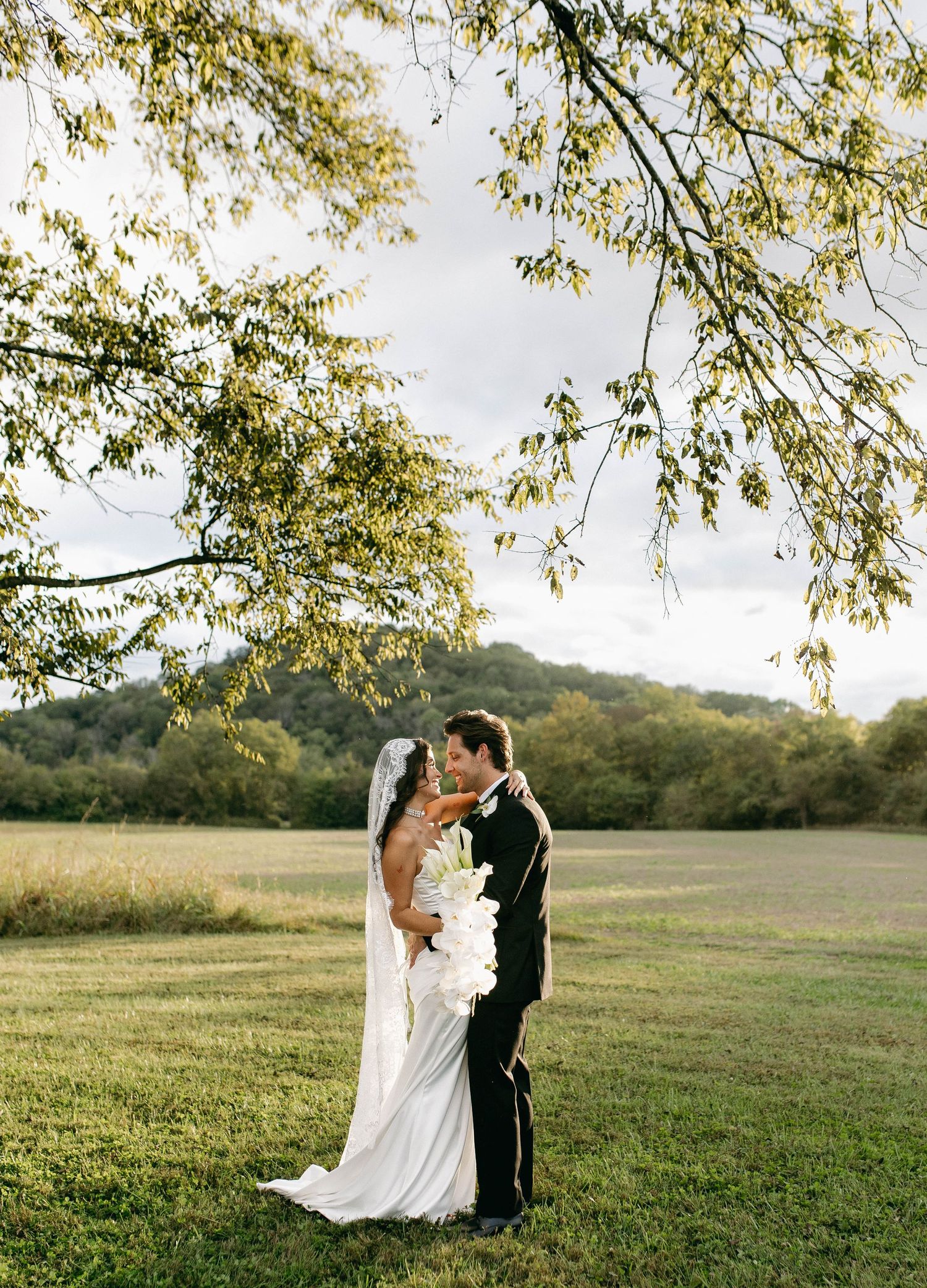 A bride and groom posing for their luxury photographer during their wedding day in Nashville, TN
