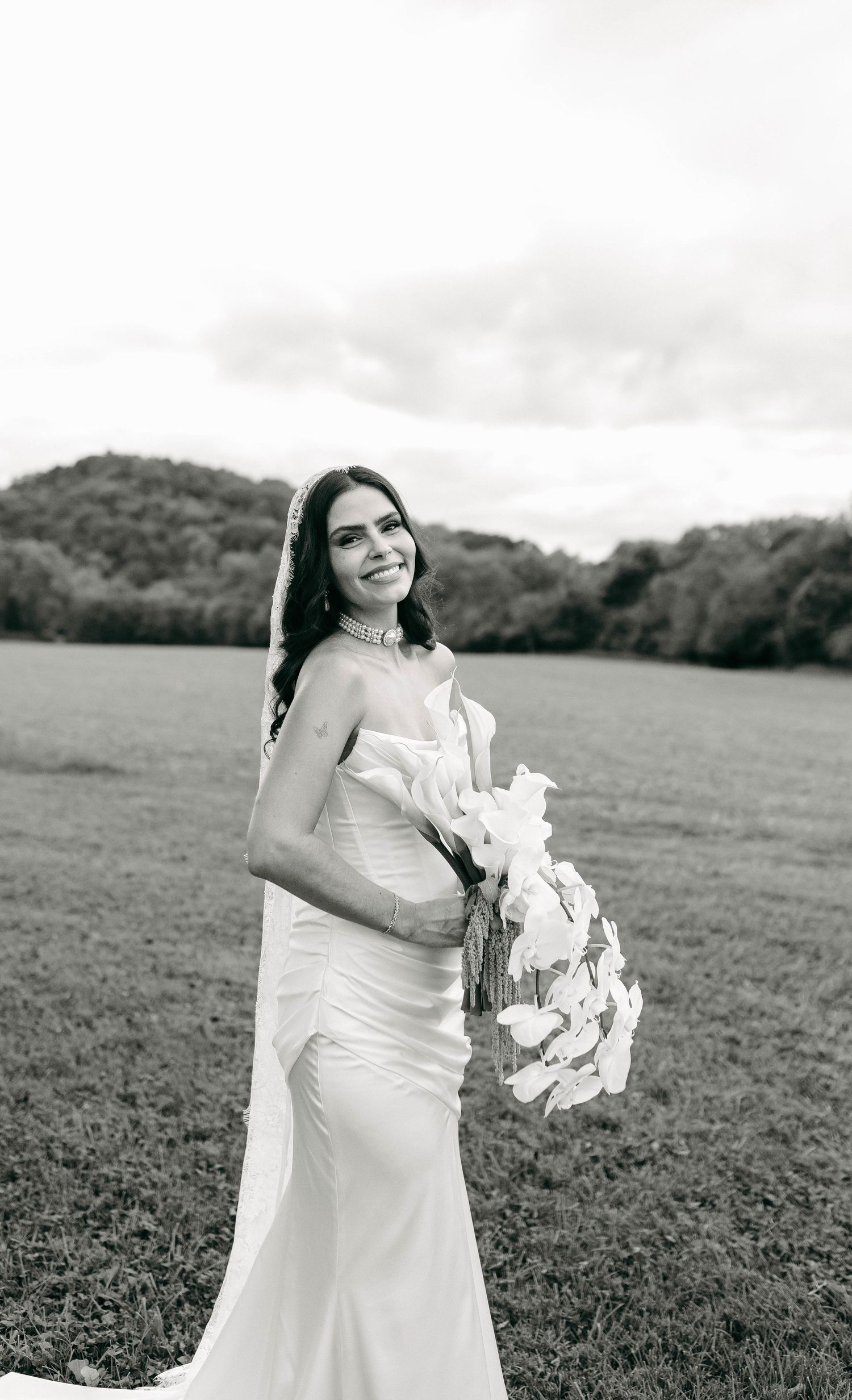 A bride and groom posing for their luxury photographer during their wedding day in Nashville, TN