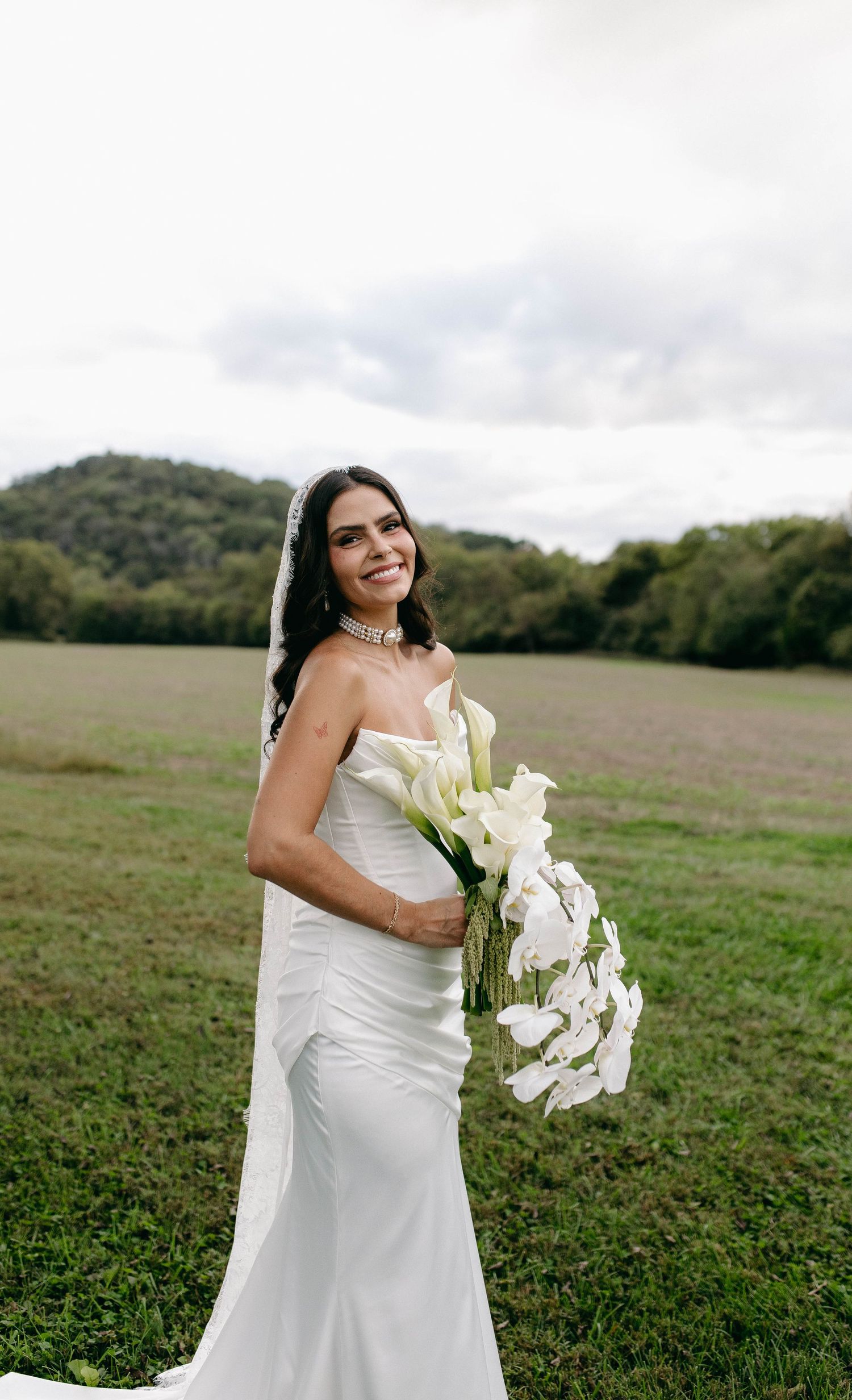 A bride and groom posing for their luxury photographer during their wedding day in Nashville, TN