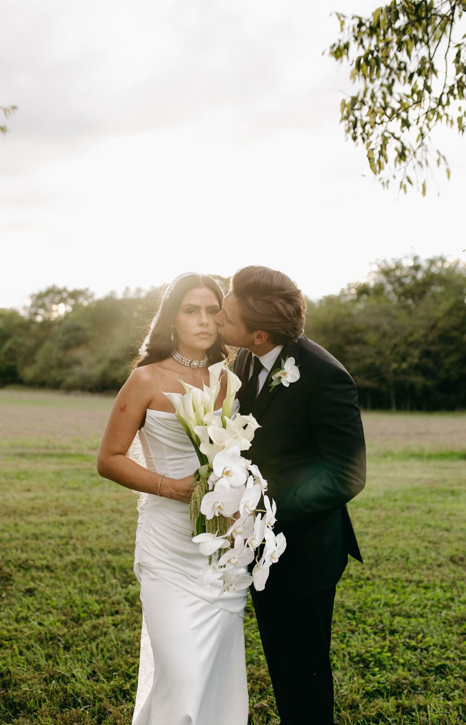 A bride and groom posing for their luxury photographer during their wedding day in Nashville, TN