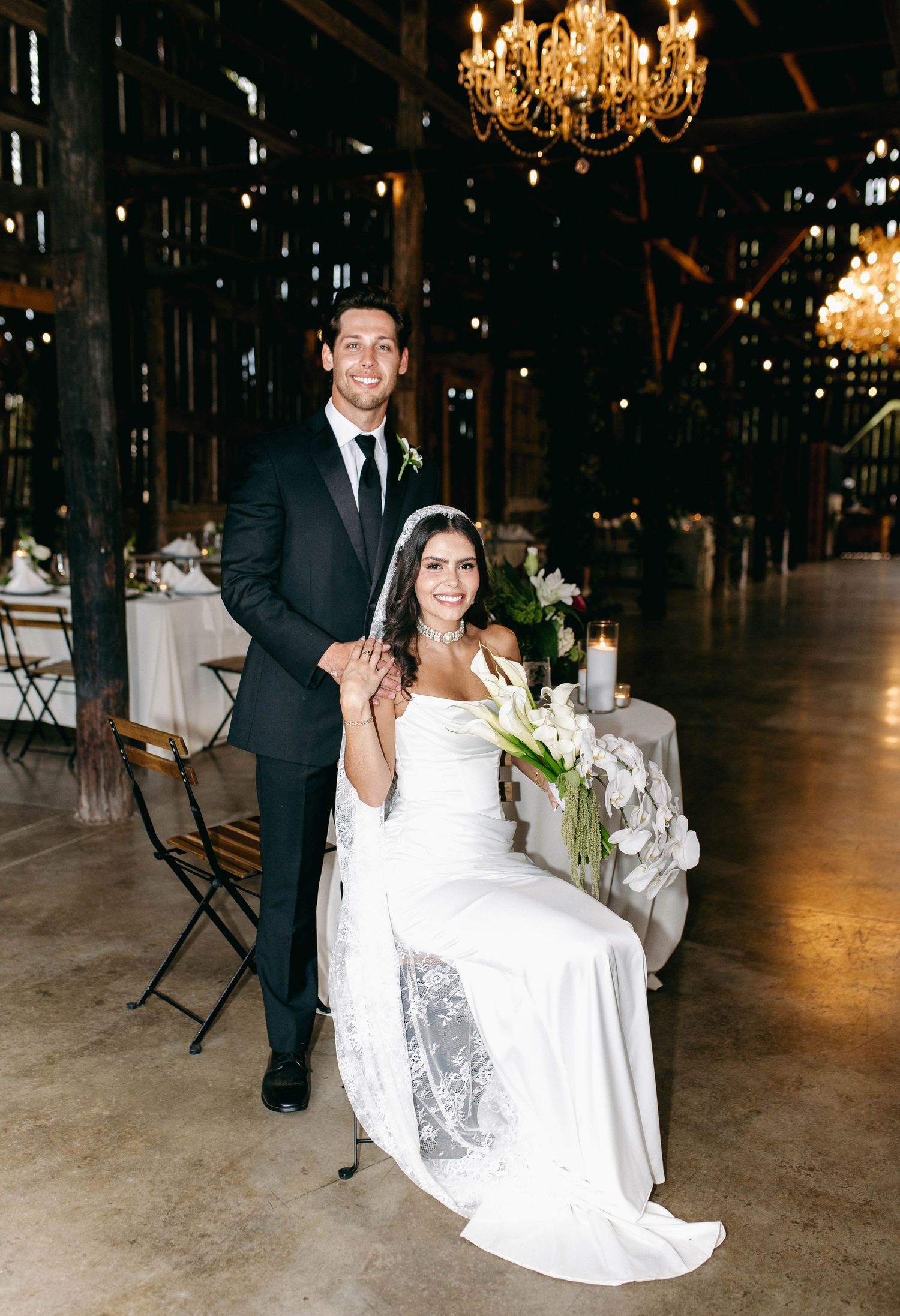 A bride and groom posing for their luxury photographer during their wedding day in Nashville, TN