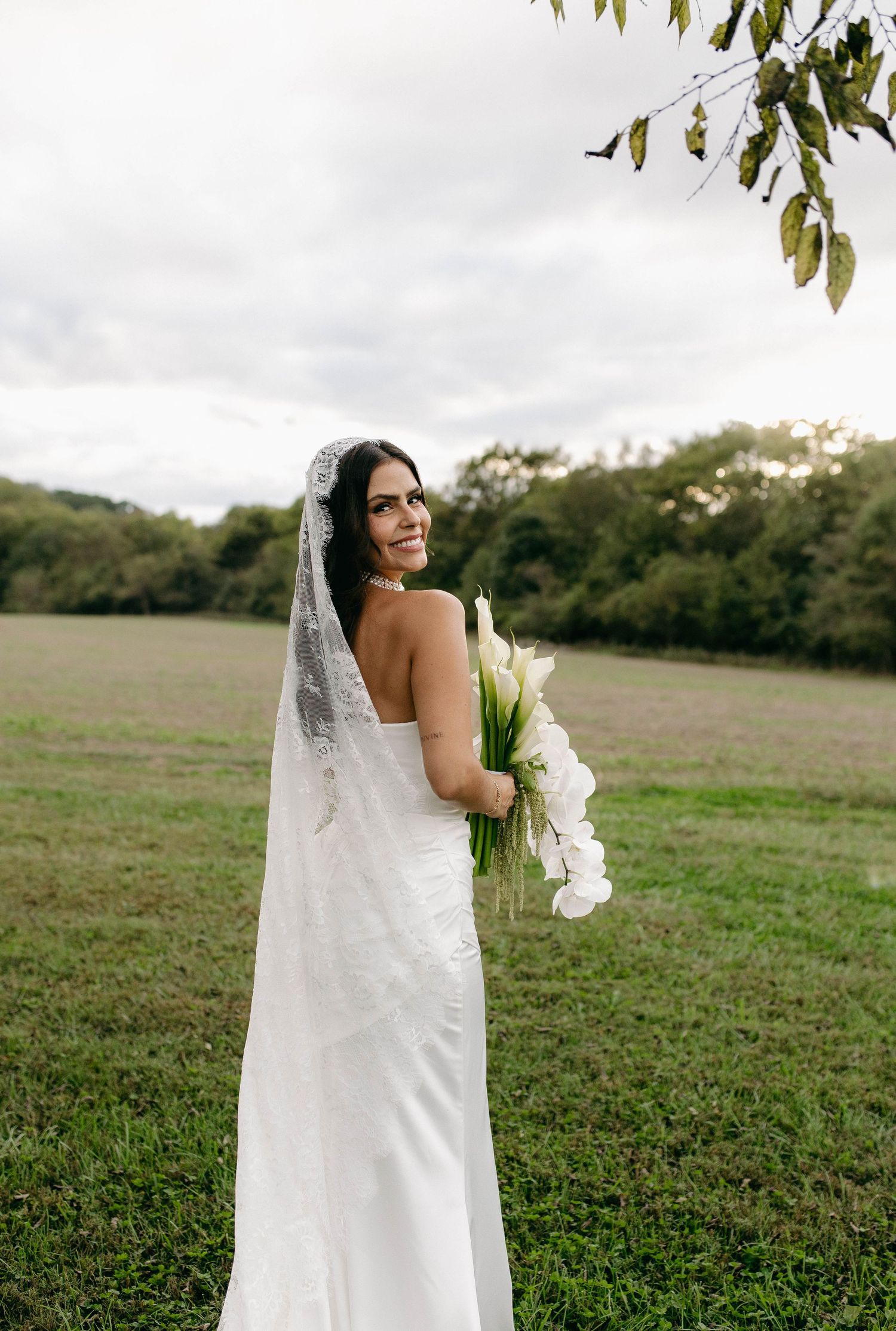 A bride and groom posing for their luxury photographer during their wedding day in Nashville, TN
