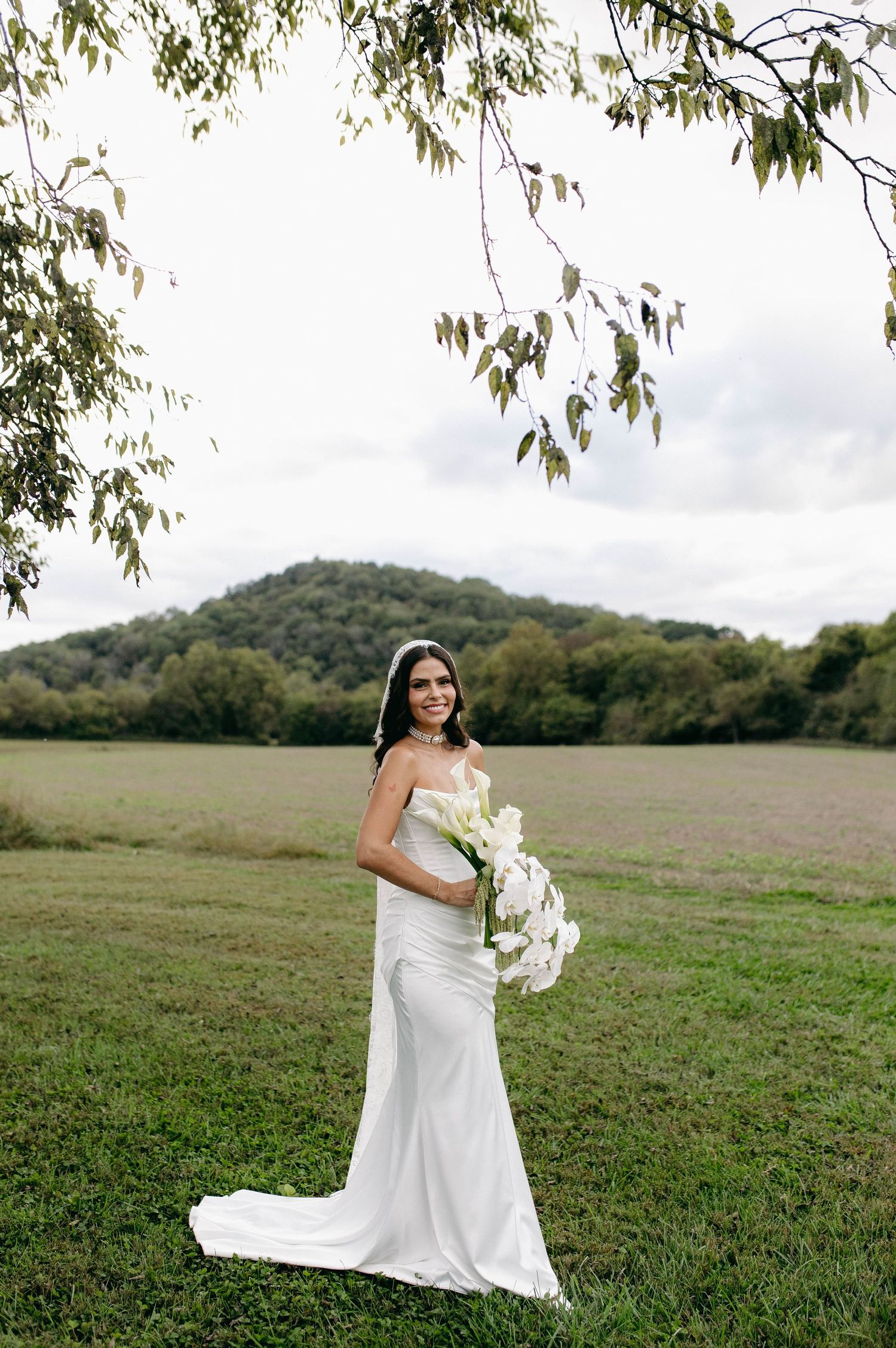 A bride and groom posing for their luxury photographer during their wedding day in Nashville, TN