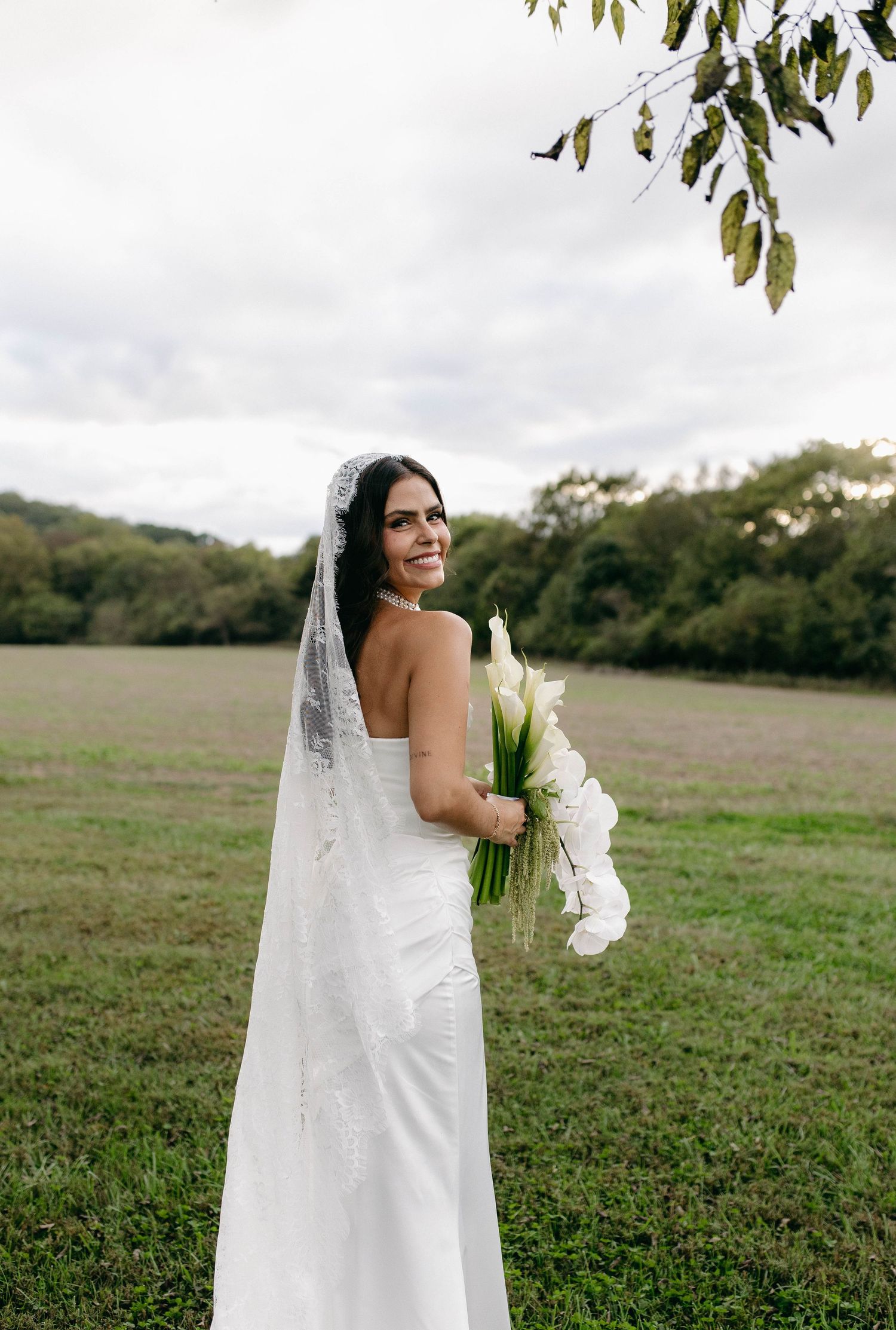 A bride and groom posing for their luxury photographer during their wedding day in Nashville, TN