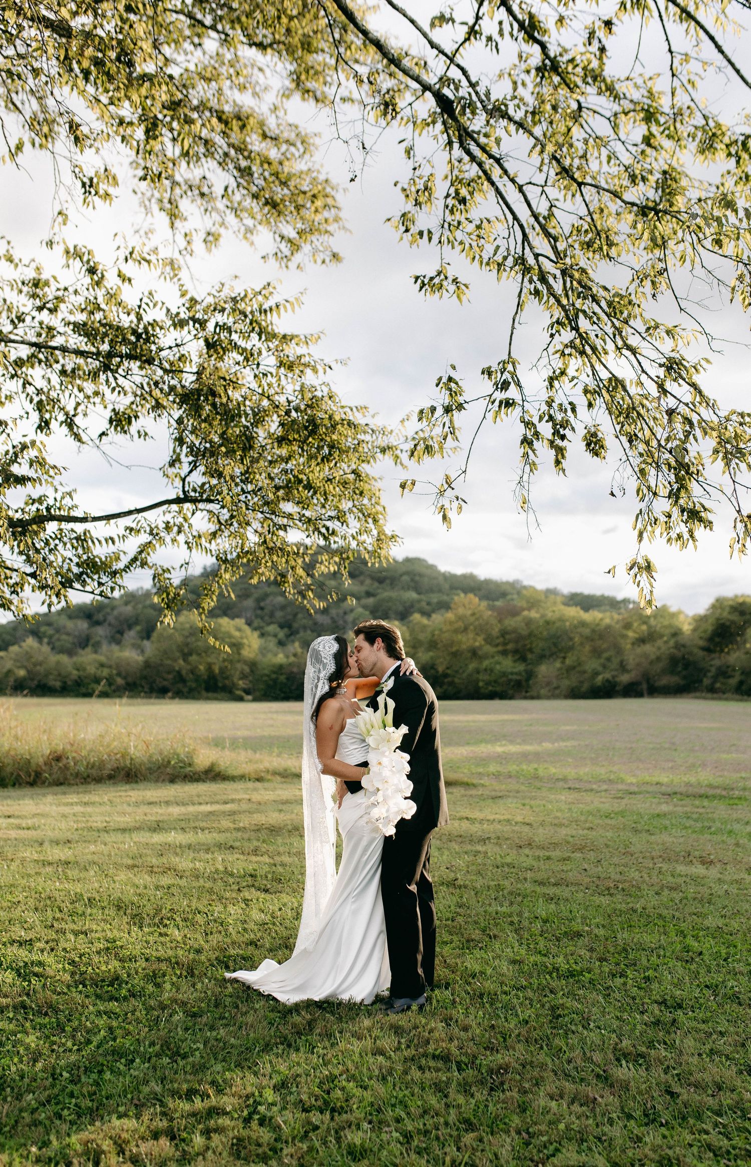 A bride and groom posing for their luxury photographer during their wedding day in Nashville, TN
