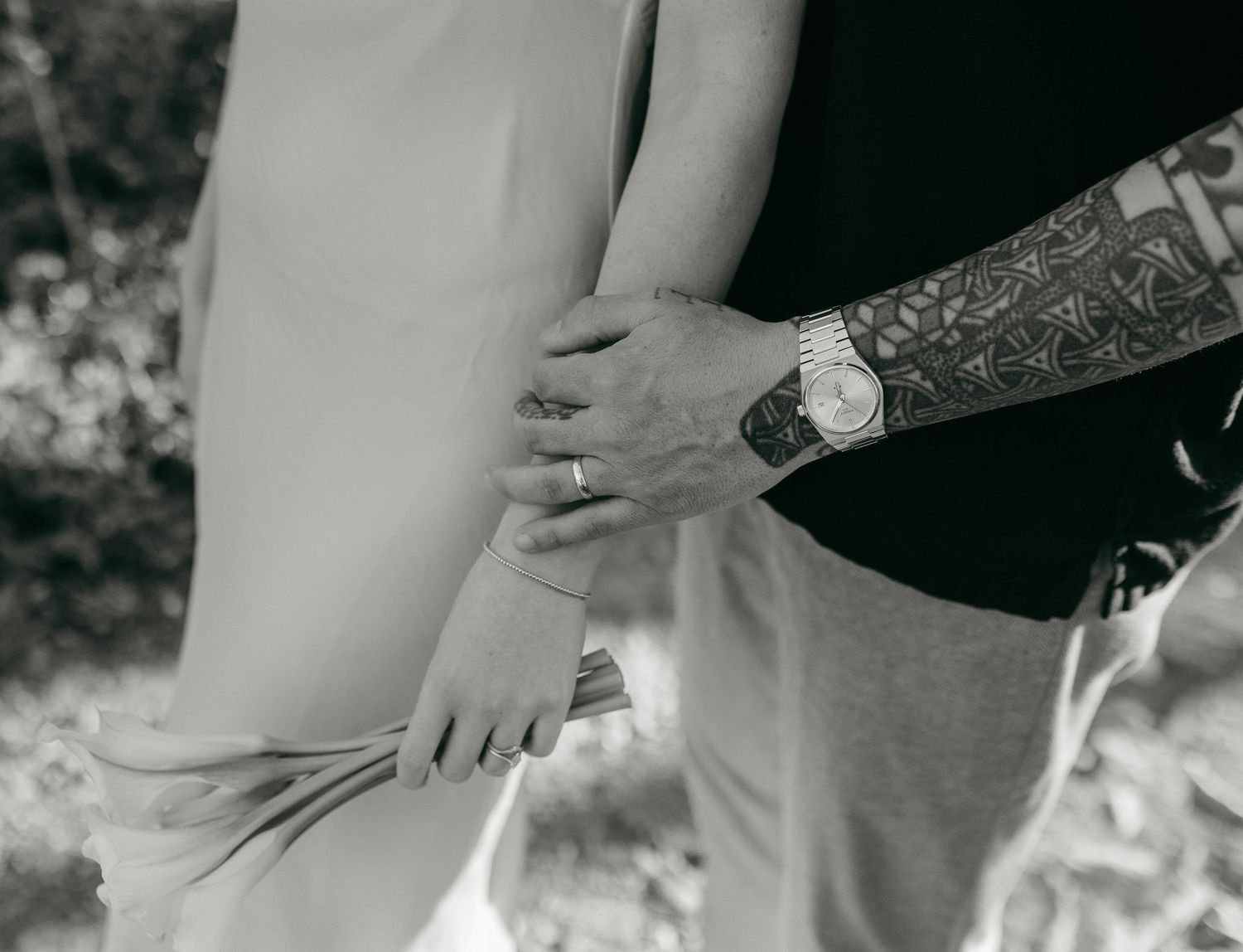 A groom touching his bride's arm in Nashville, TN
