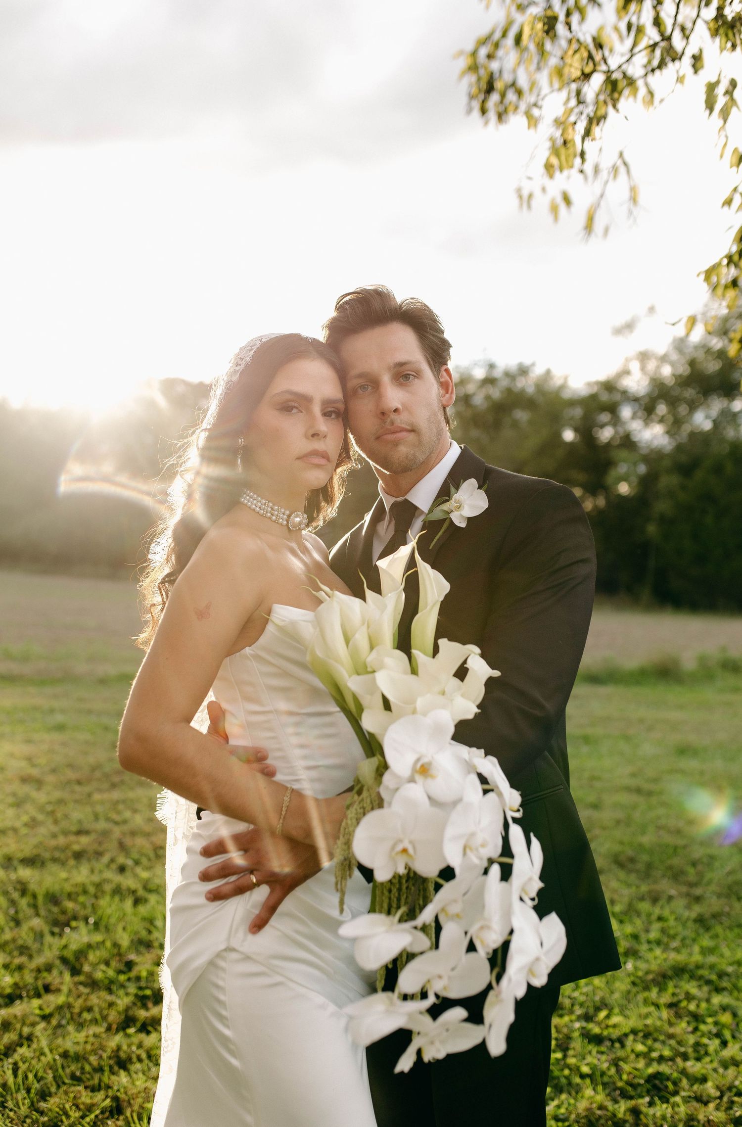 A bride and groom posing for their luxury photographer during their wedding day in Nashville, TN