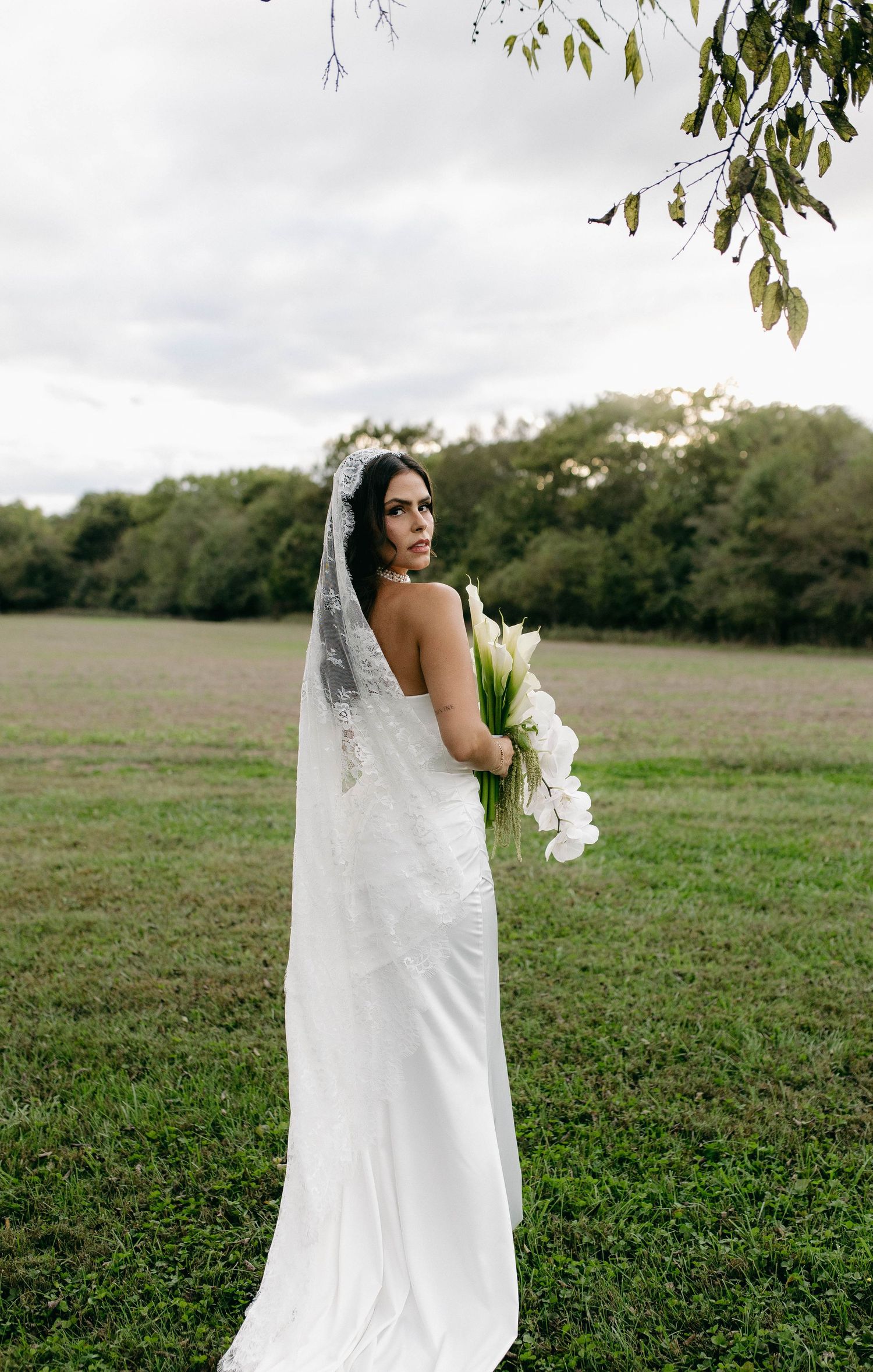 A bride and groom posing for their luxury photographer during their wedding day in Nashville, TN
