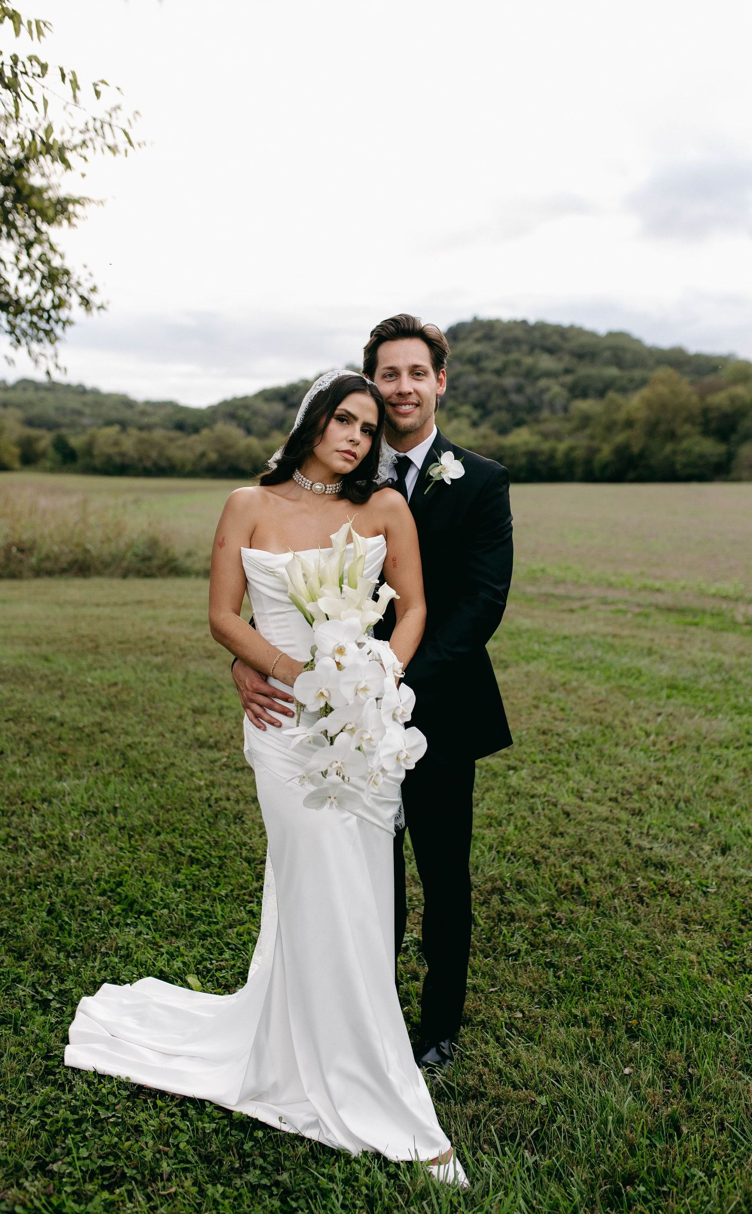 A bride and groom posing for their luxury photographer during their wedding day in Nashville, TN