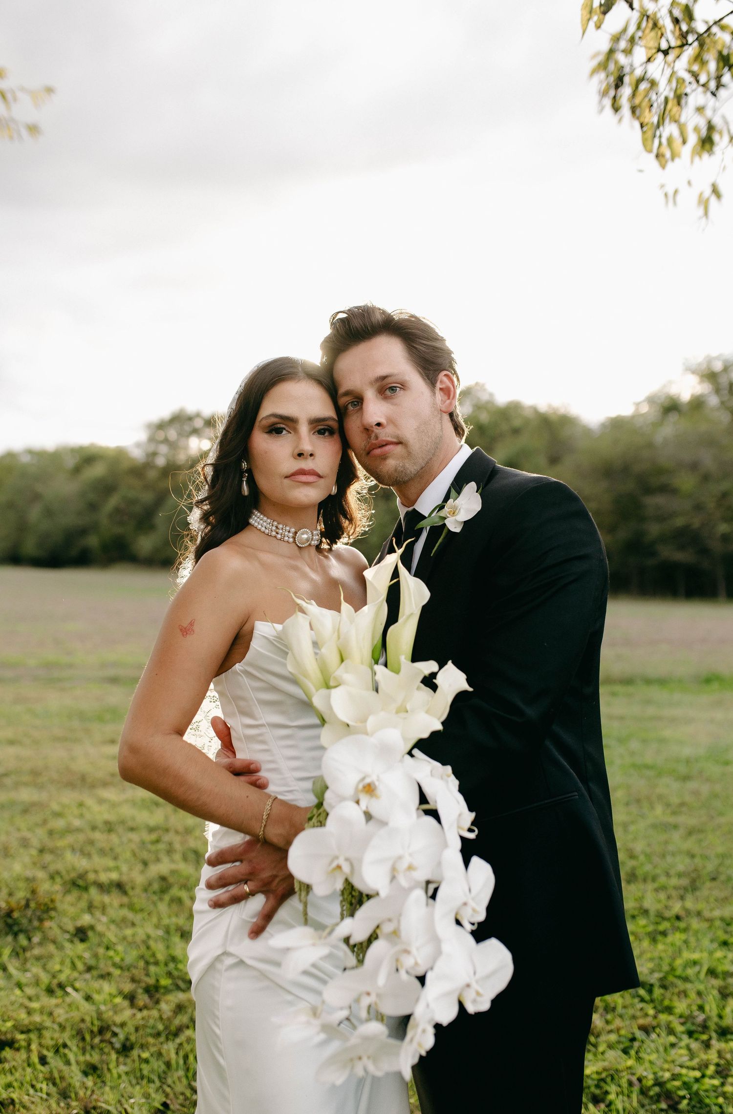 A bride and groom posing for their luxury photographer during their wedding day in Nashville, TN