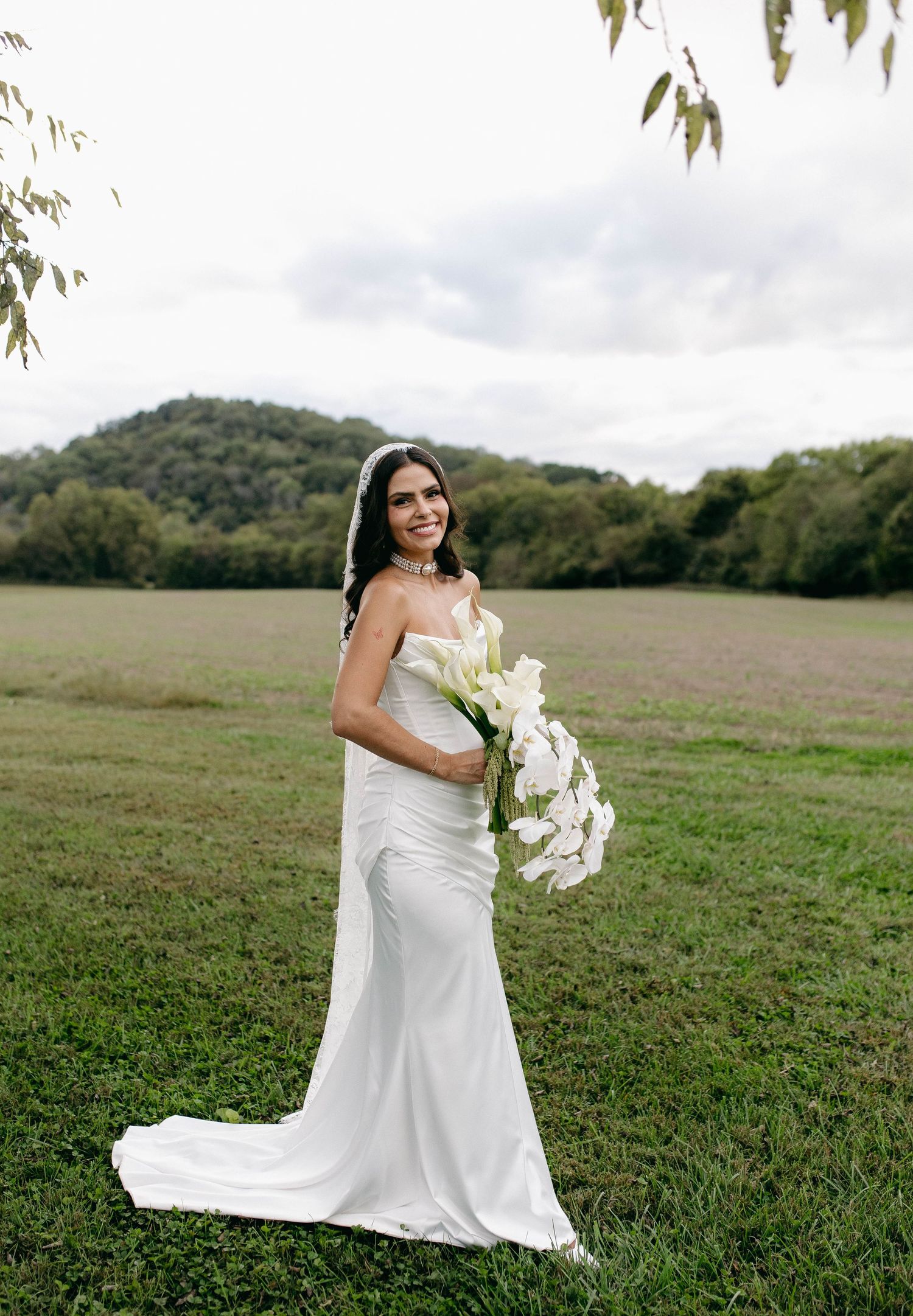 A bride and groom posing for their luxury photographer during their wedding day in Nashville, TN