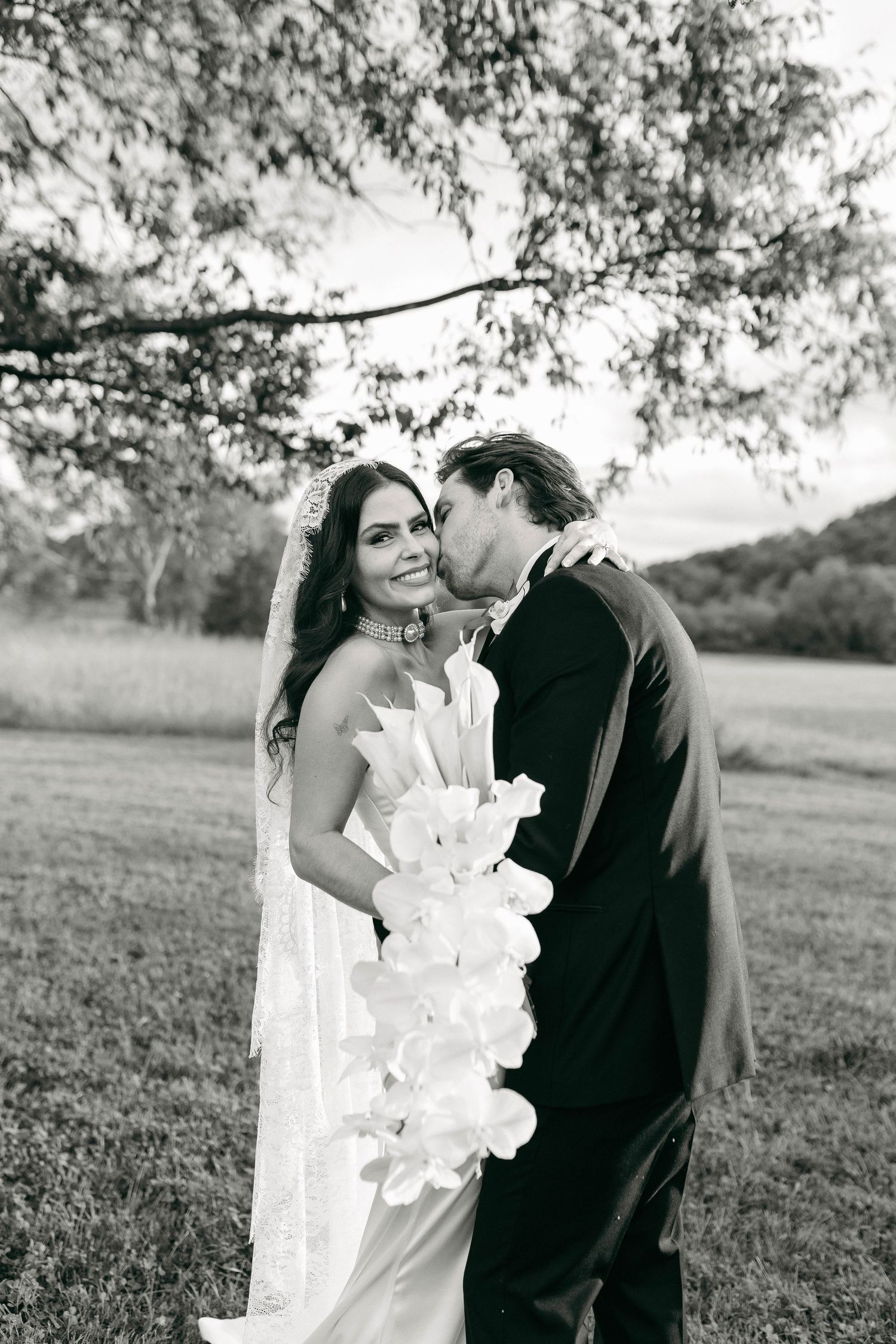 A bride and groom posing for their luxury photographer during their wedding day in Nashville, TN