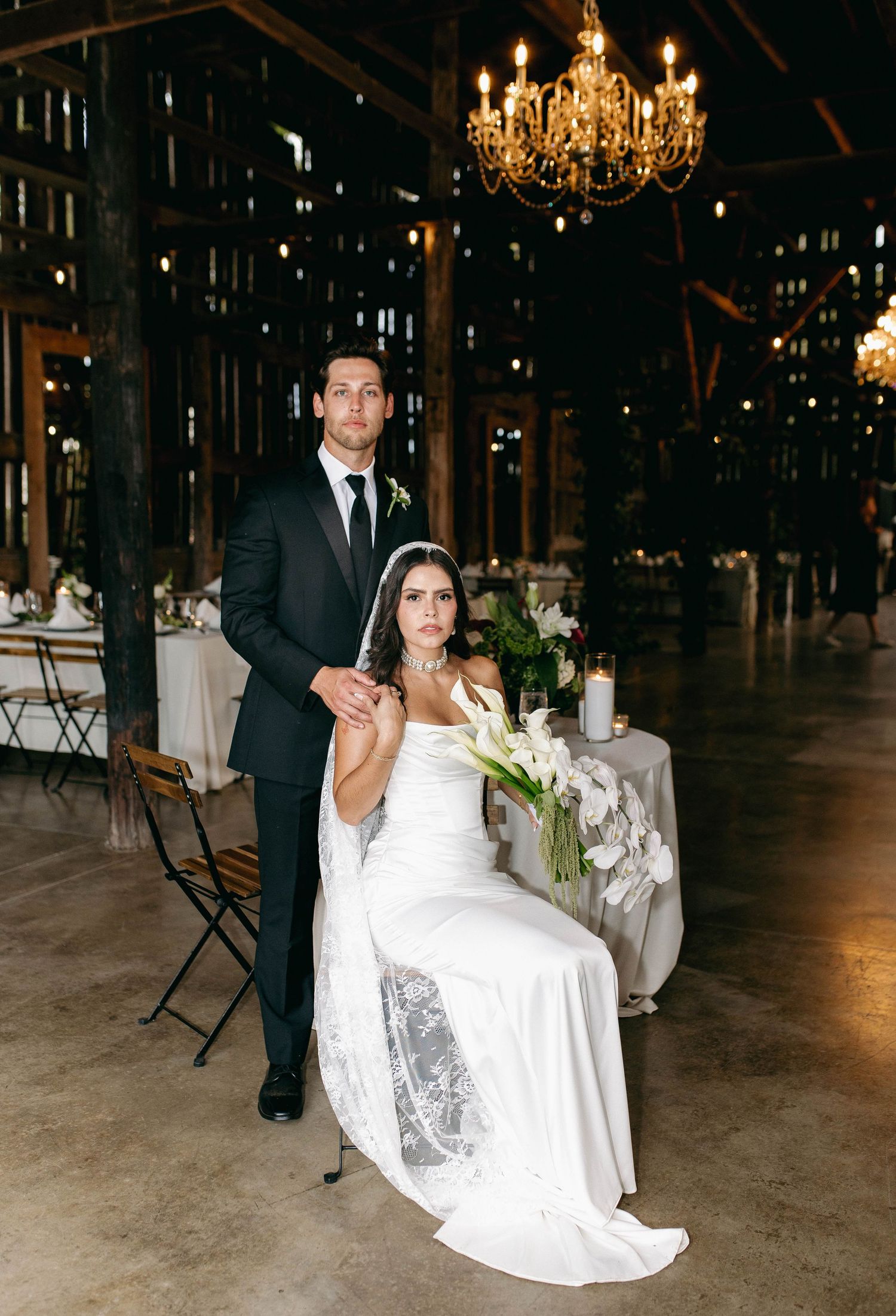 A bride and groom posing for their luxury photographer during their wedding day in Nashville, TN