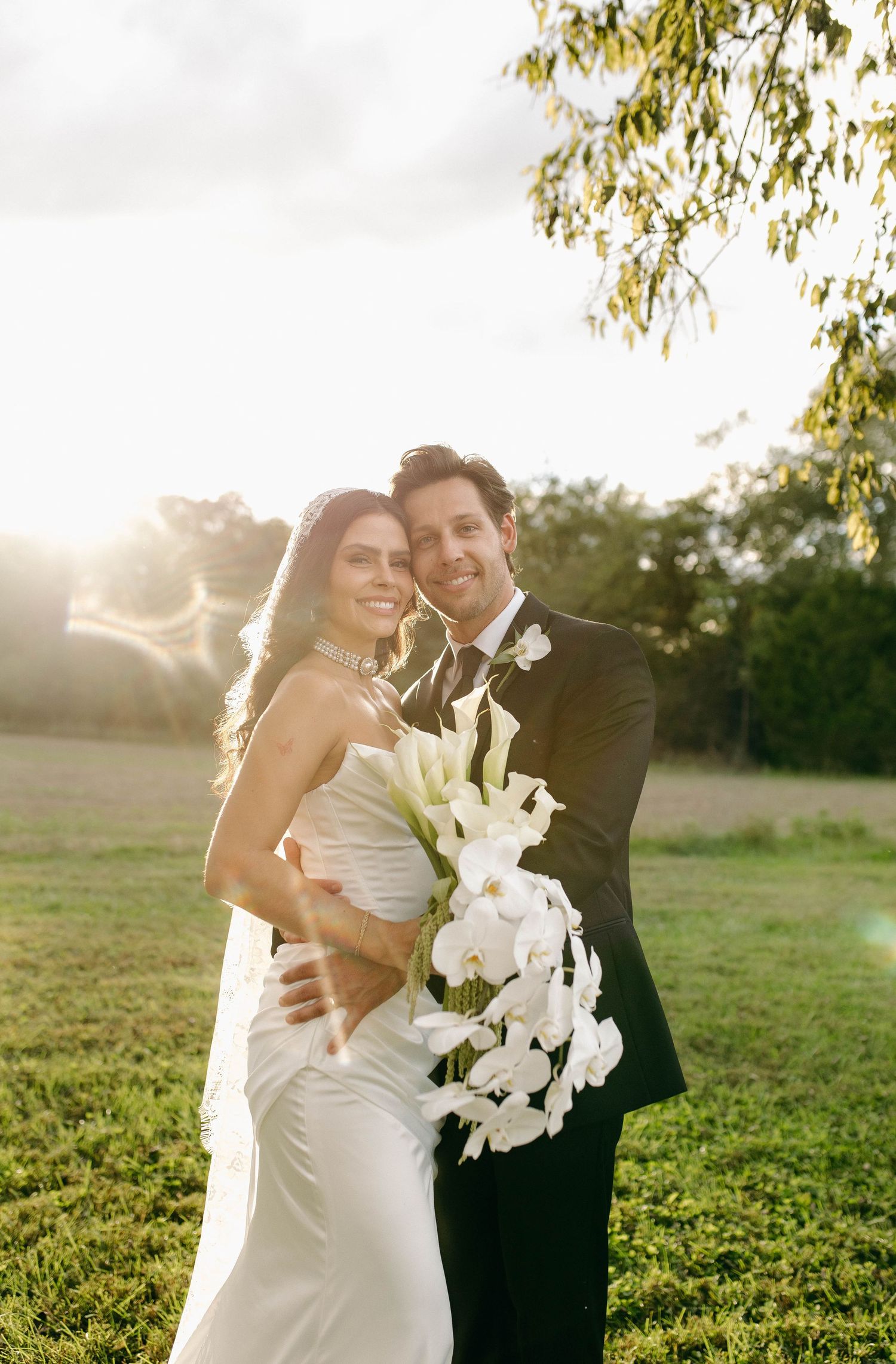 A bride and groom posing for their luxury photographer during their wedding day in Nashville, TN