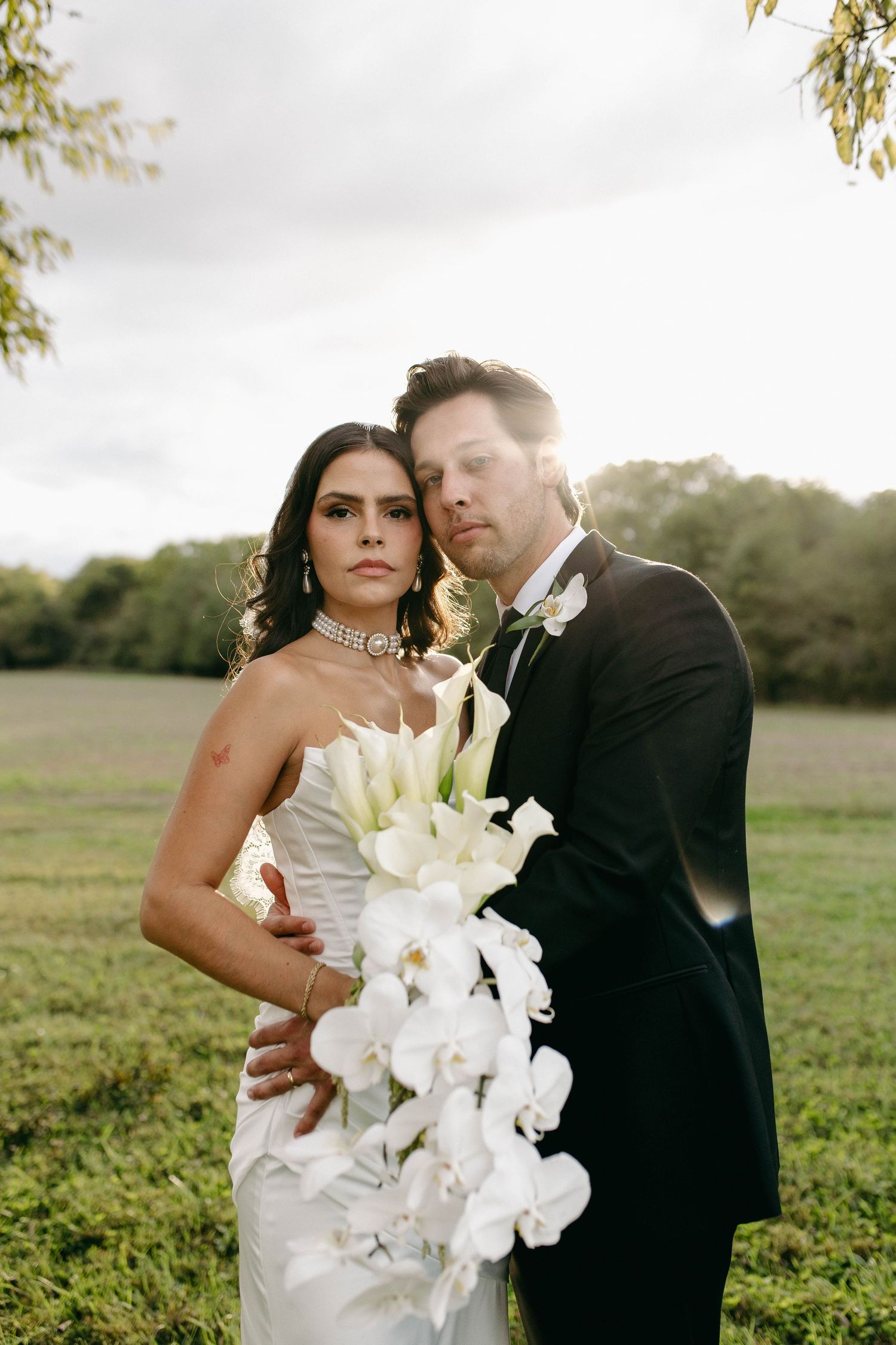 A bride and groom posing for their luxury photographer during their wedding day in Nashville, TN