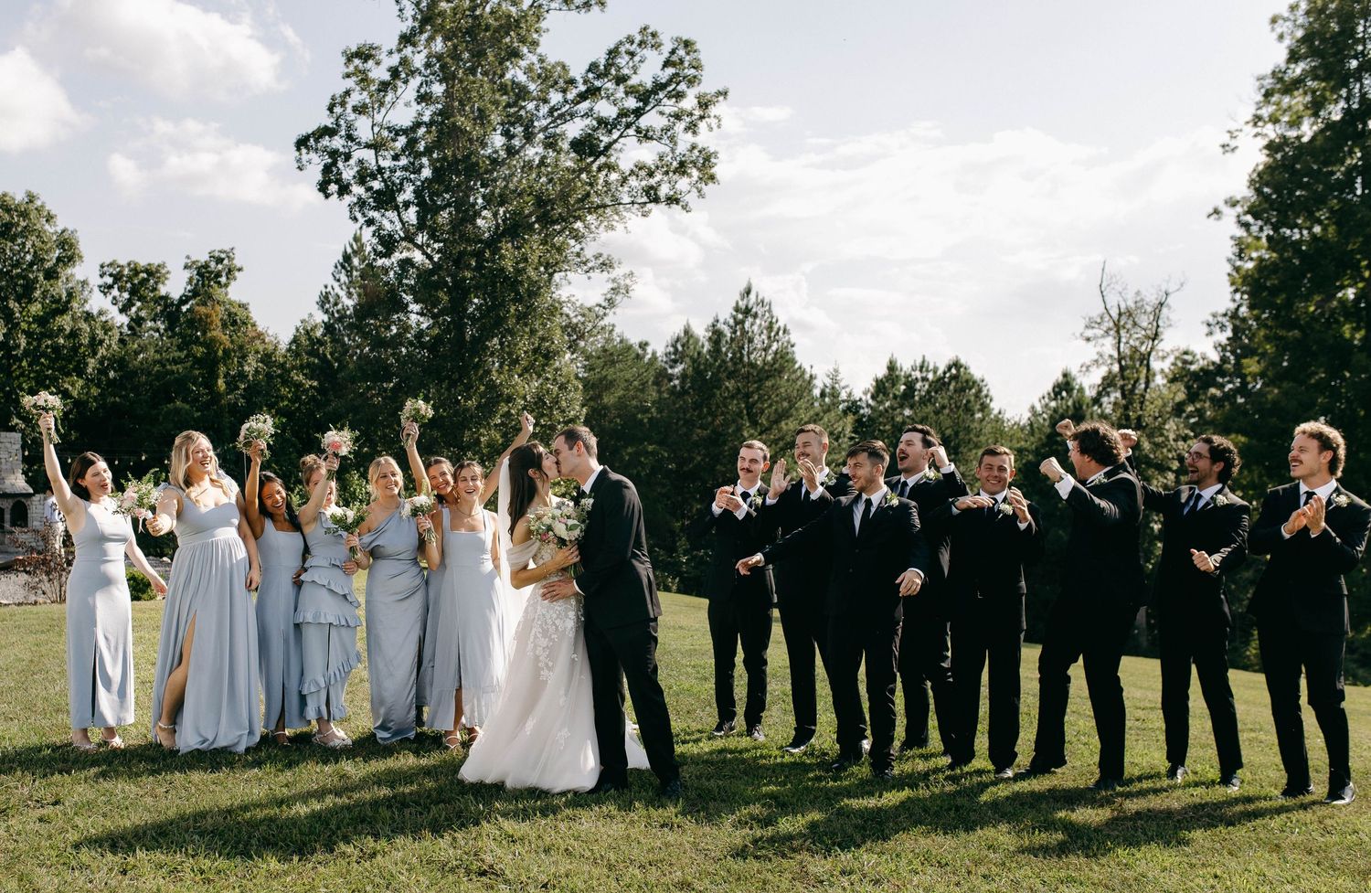 A bridal party posing for a photo taken by a documentary photographer in Nashville, TN