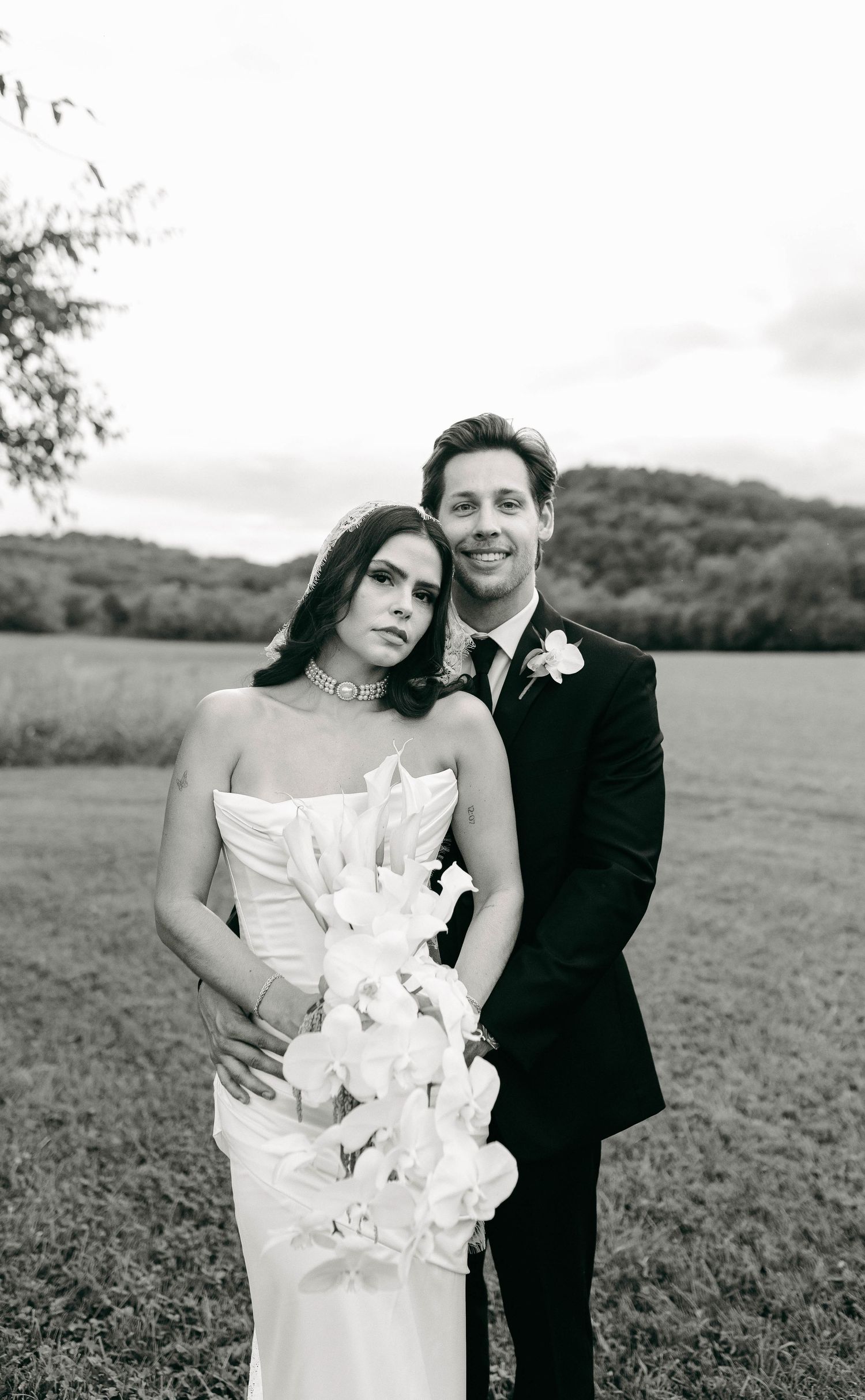 A bride and groom posing for their luxury photographer during their wedding day in Nashville, TN