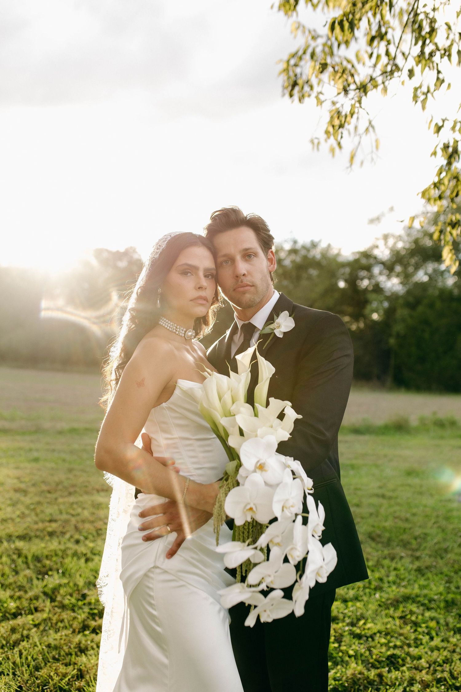 A bride and groom posing for their luxury photographer during their wedding day in Nashville, TN