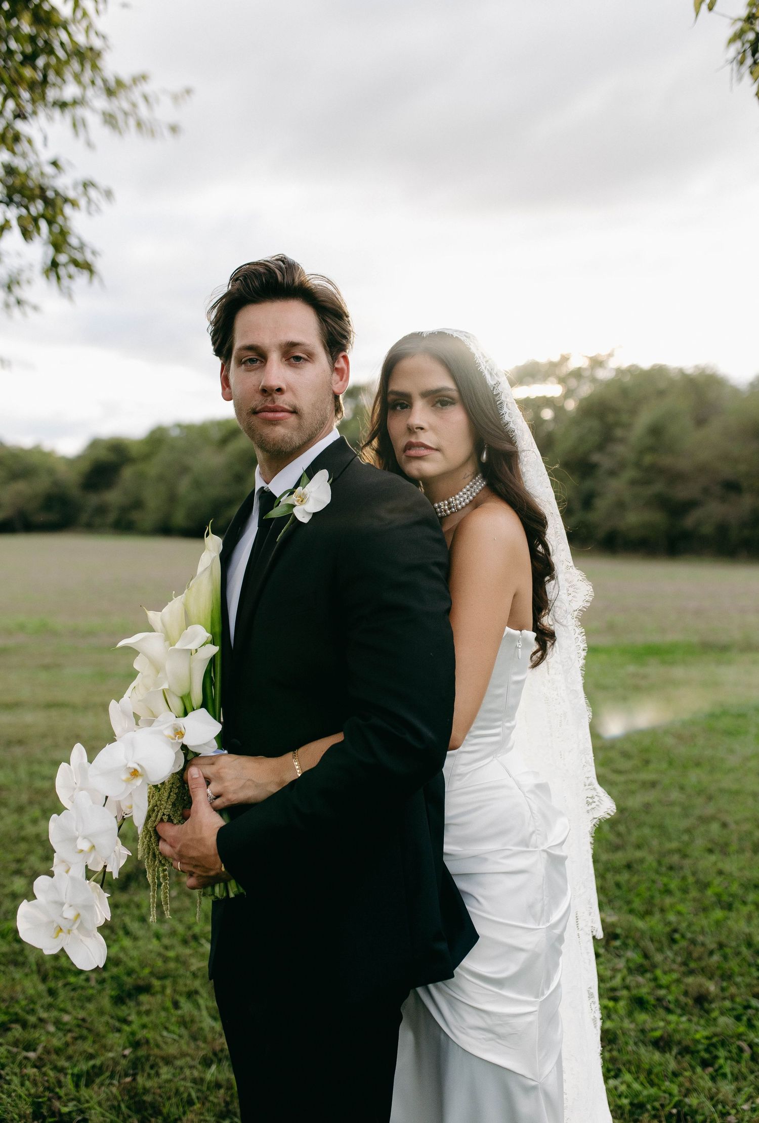 A bride and groom posing for their luxury photographer during their wedding day in Nashville, TN