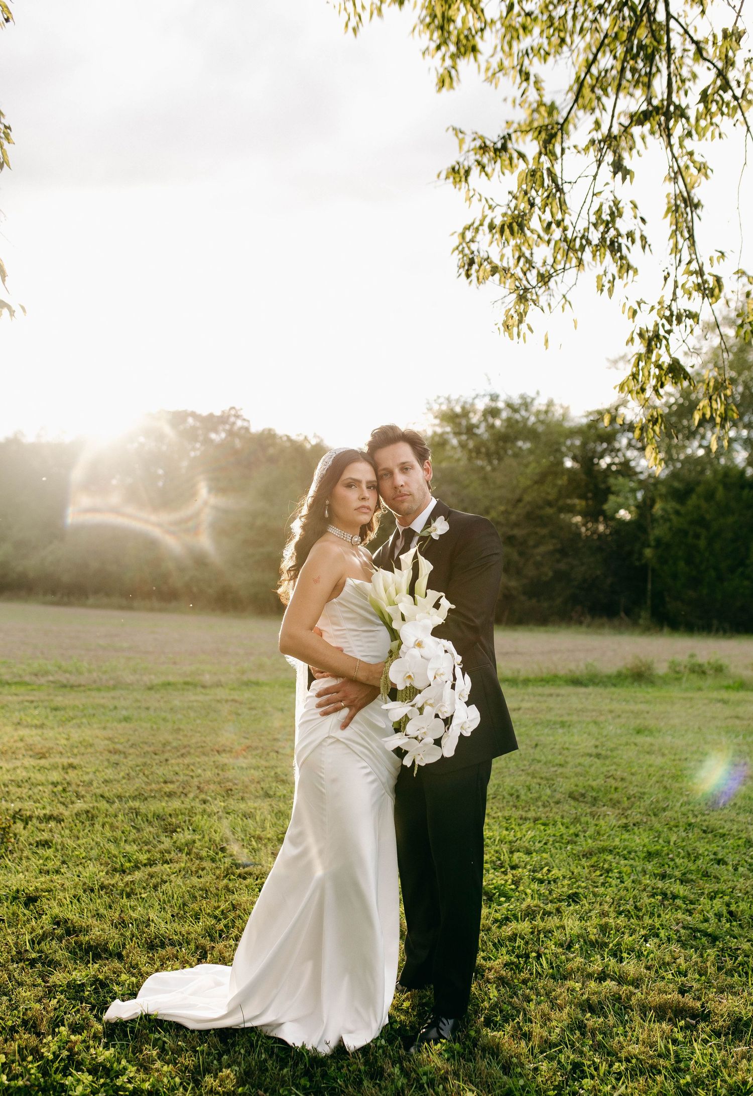A bride and groom posing for their luxury photographer during their wedding day in Nashville, TN
