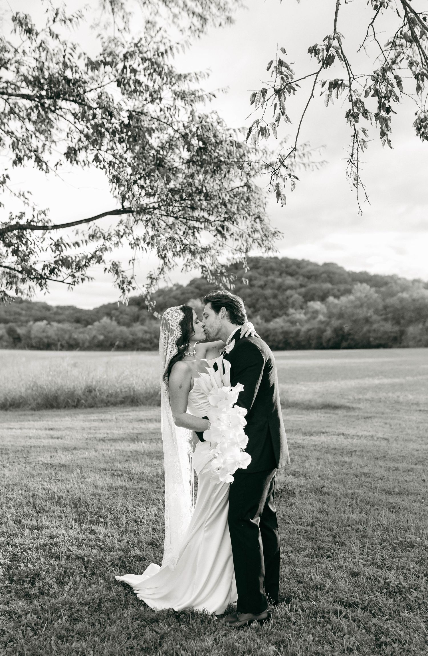 A bride and groom posing for their luxury photographer during their wedding day in Nashville, TN