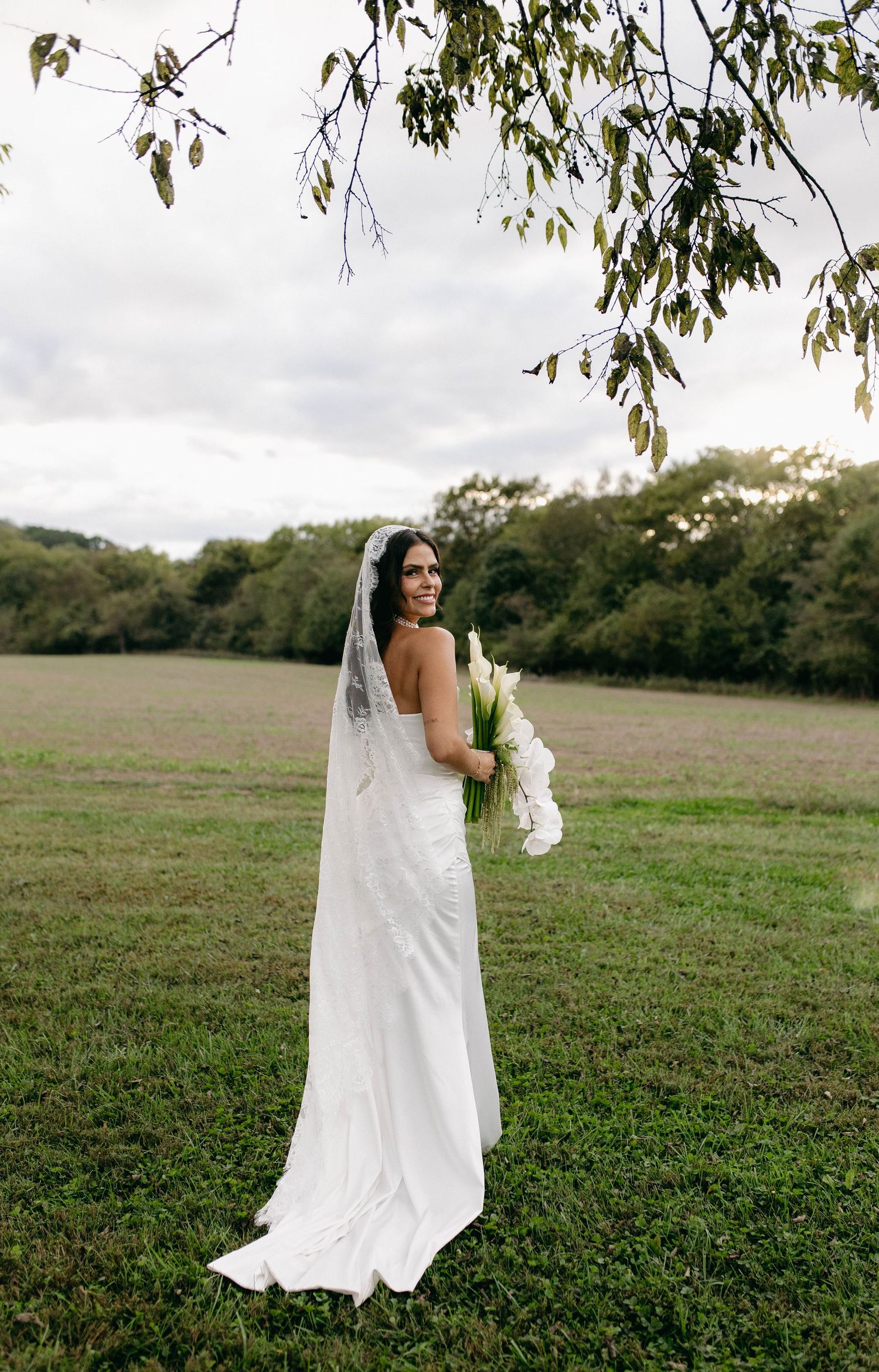 A bride and groom posing for their luxury photographer during their wedding day in Nashville, TN
