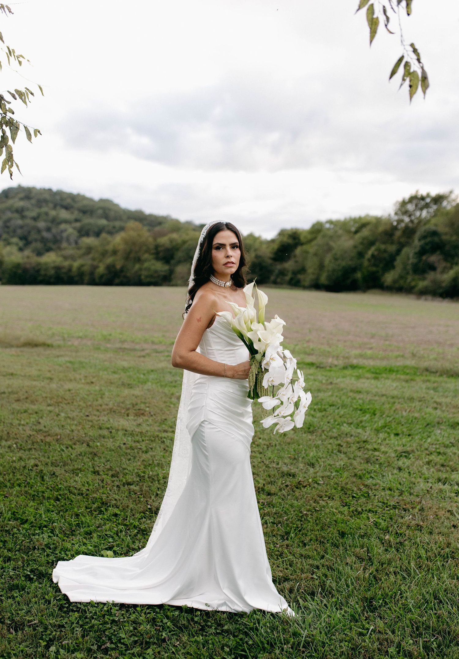 A bride and groom posing for their luxury photographer during their wedding day in Nashville, TN