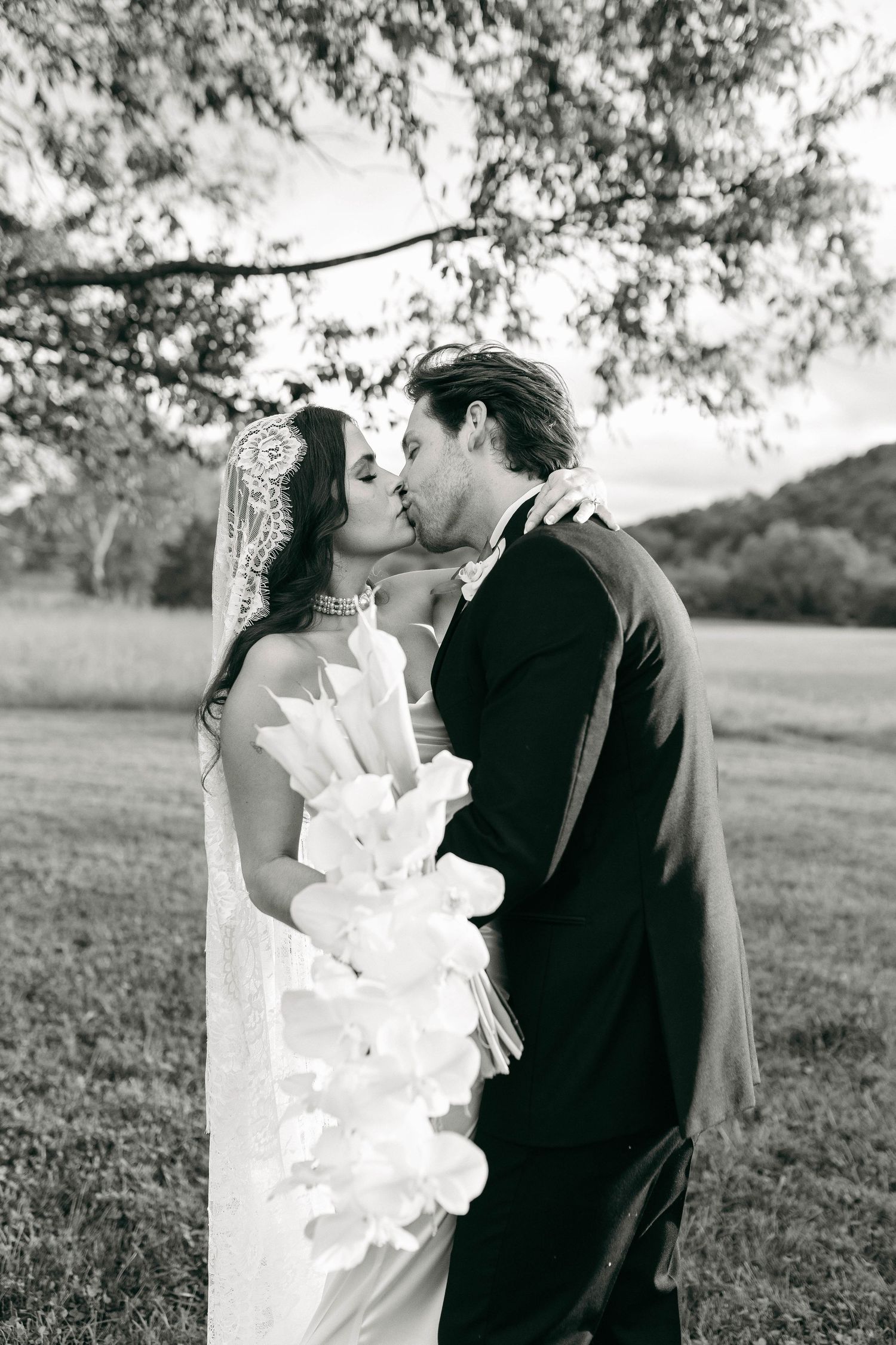 A bride and groom posing for their luxury photographer during their wedding day in Nashville, TN