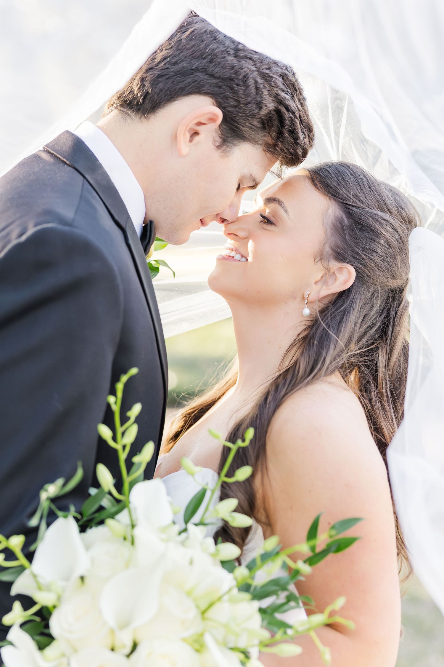 Romantic close-up shots of a couple sharing intimate moments on their wedding day.