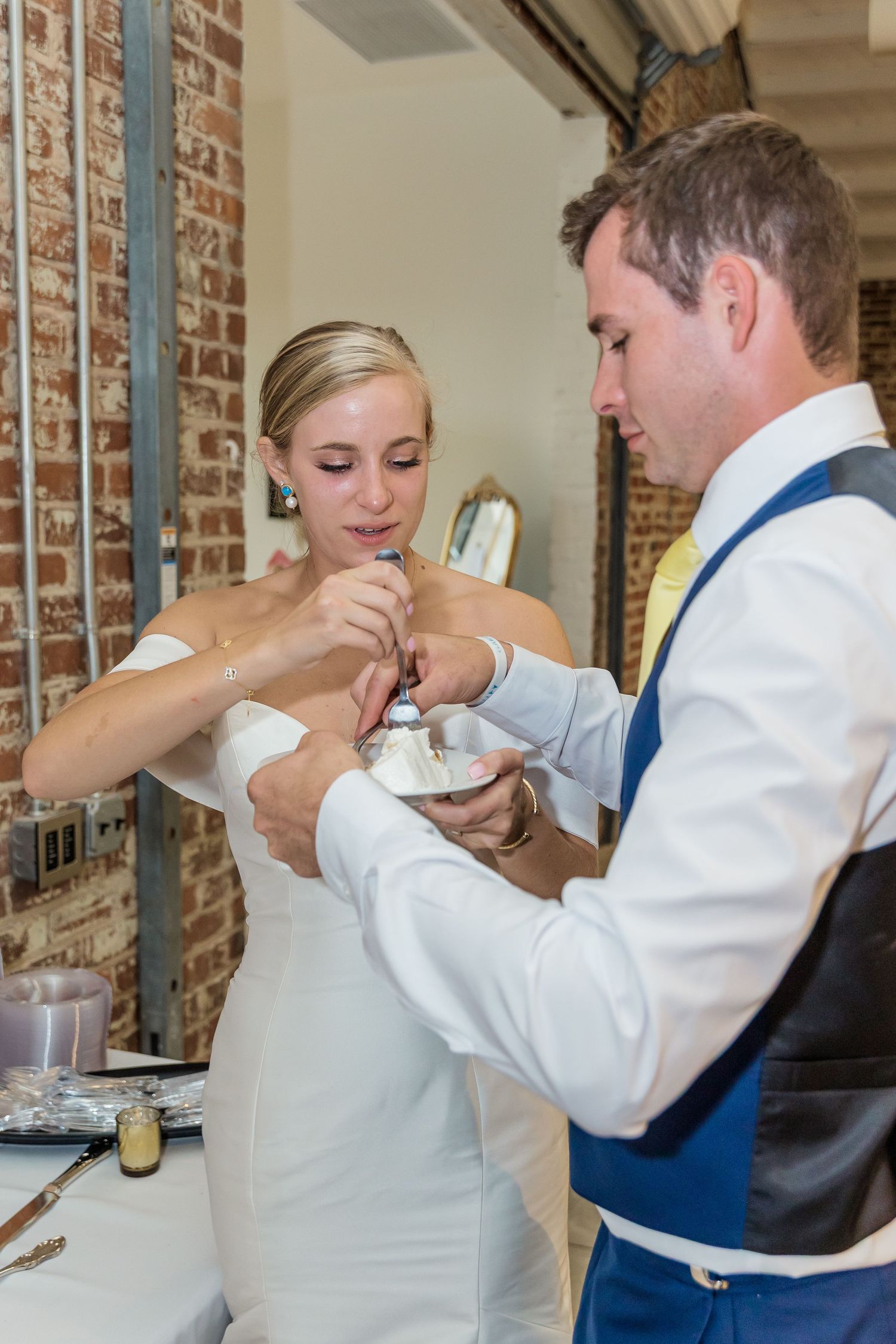 A sequence of photos showing a bride and groom sharing a playful champagne toast at their wedding reception.