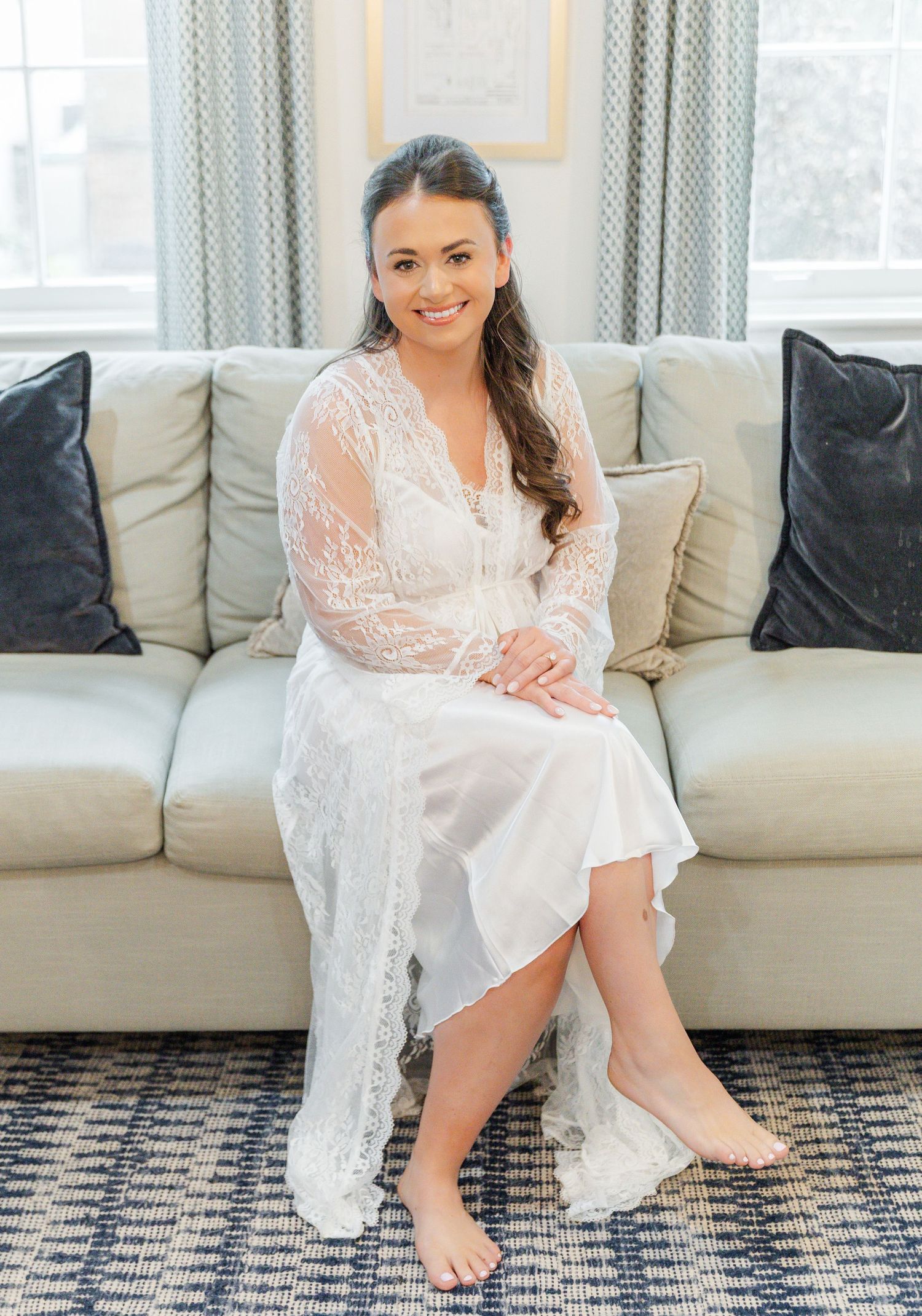 Four sequential photos show someone in a white lace robe sitting on a patterned rug in front of a gray couch.