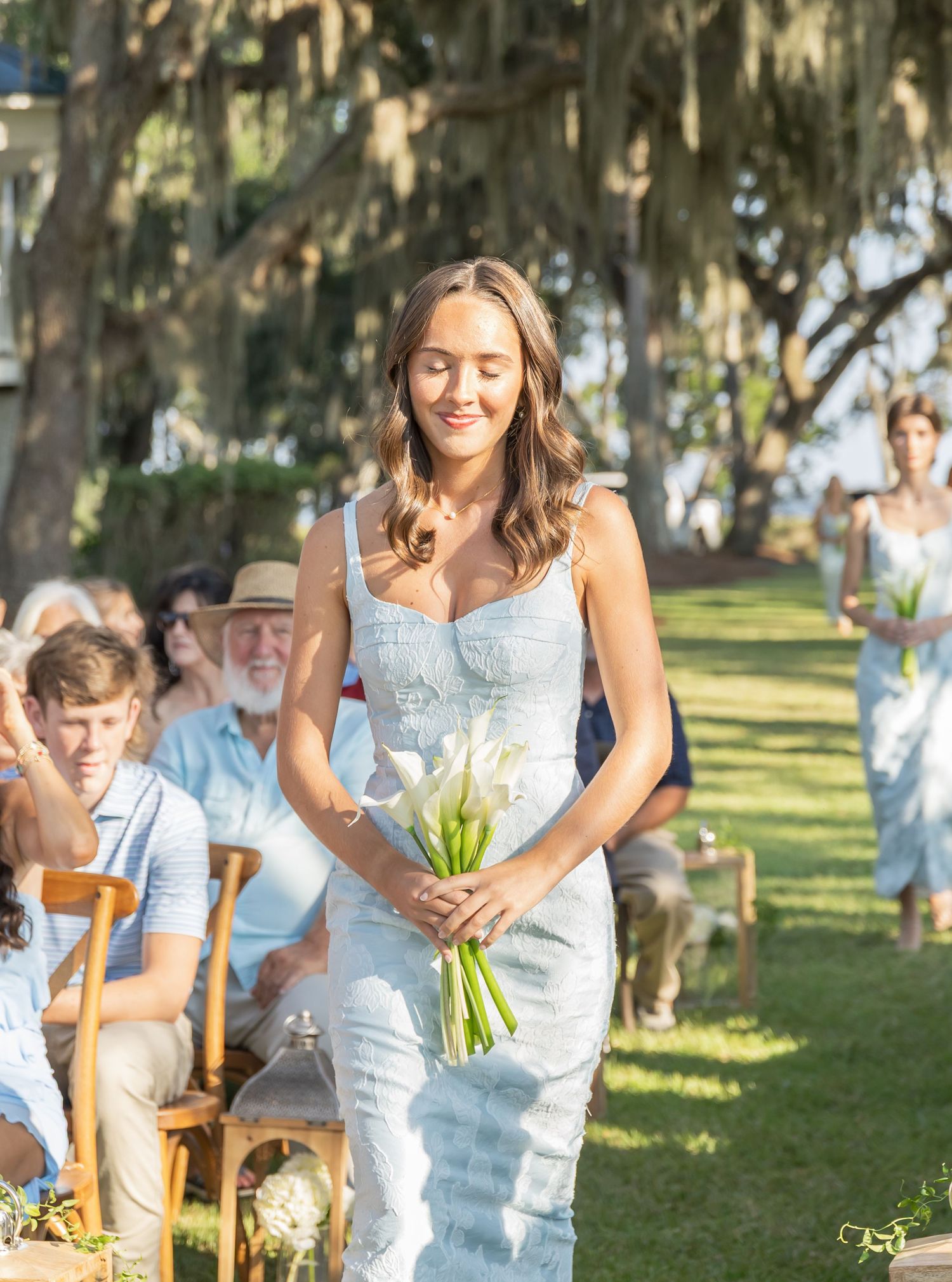 A series of wedding photos showing people in formal attire celebrating outdoors under oak trees draped with Spanish moss.