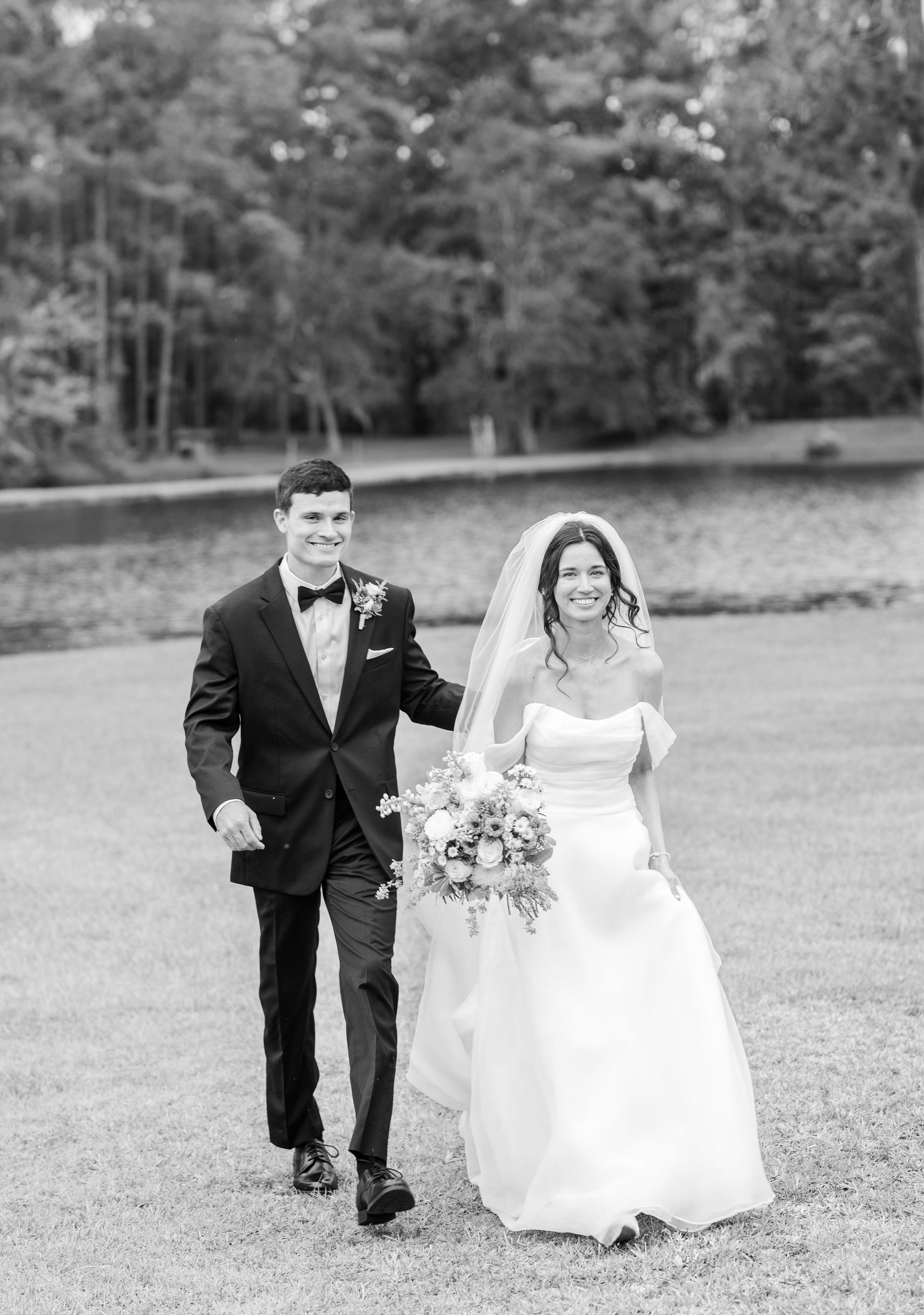 Black and white wedding photo sequence showing couple running and laughing together across an open field.