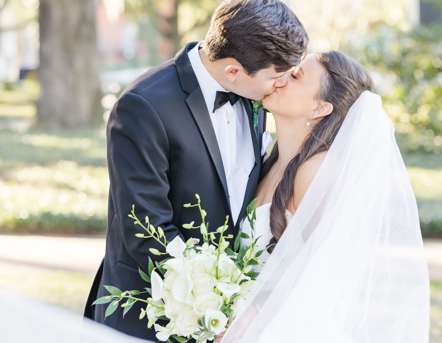 Intimate wedding portrait moments captured in natural outdoor setting.