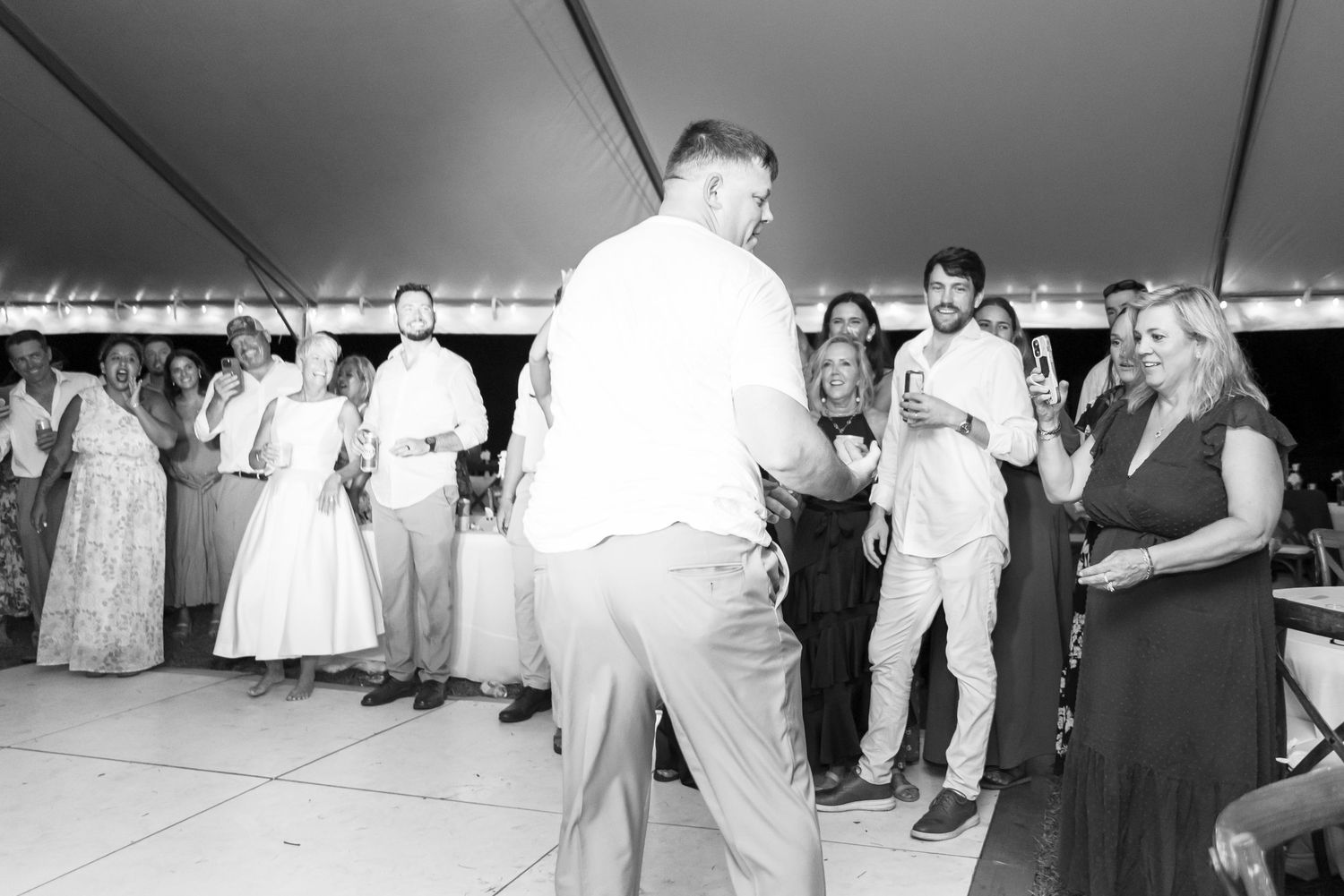 A sequence of black and white wedding photos showing couples dancing and celebrating at a reception party.