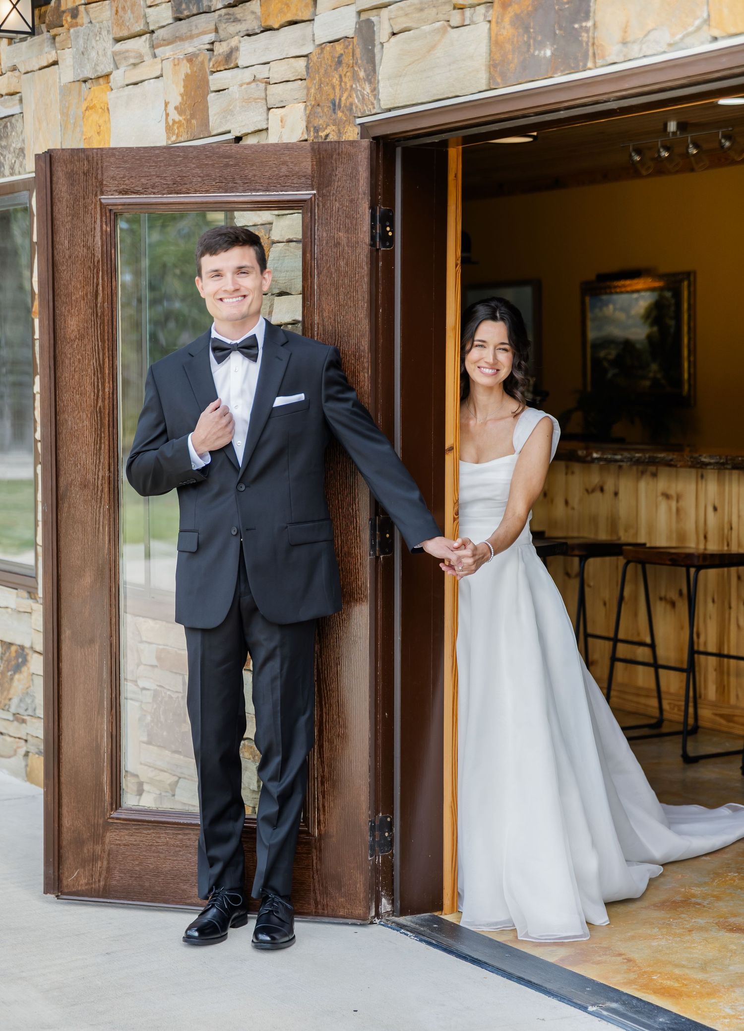 Playful wedding portrait series showing couple peeking around stone wall corners and doorways in formal attire.