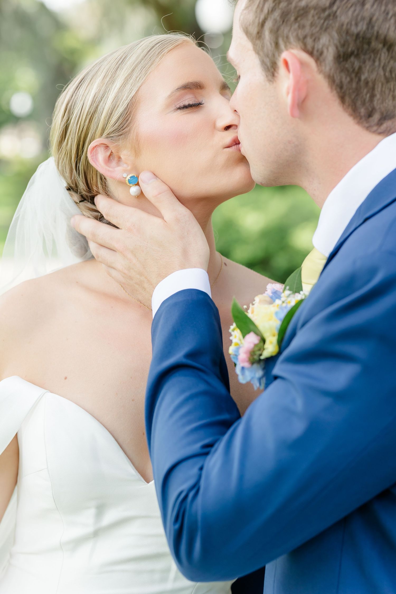 A bride and groom share a romantic kiss outdoors in a series of intimate wedding photographs.