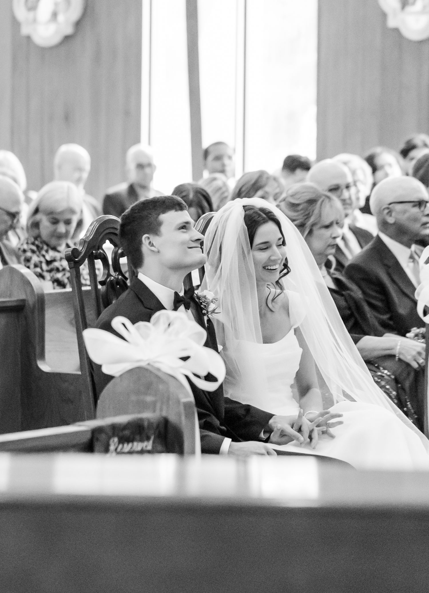 Black and white candid shots of joyful moments during church wedding ceremony.