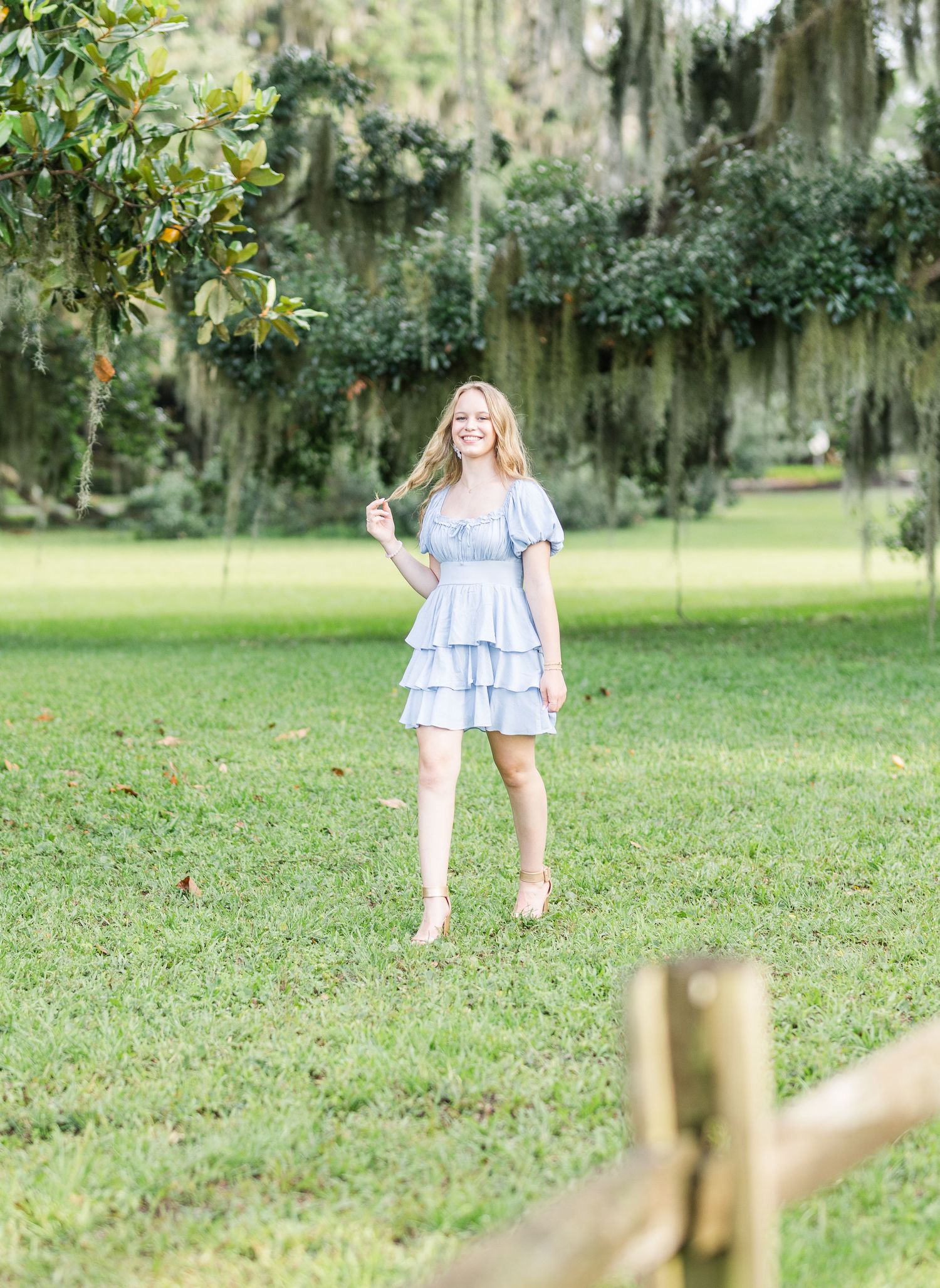 Series of photos showing someone walking through a grassy area with Spanish moss in trees.