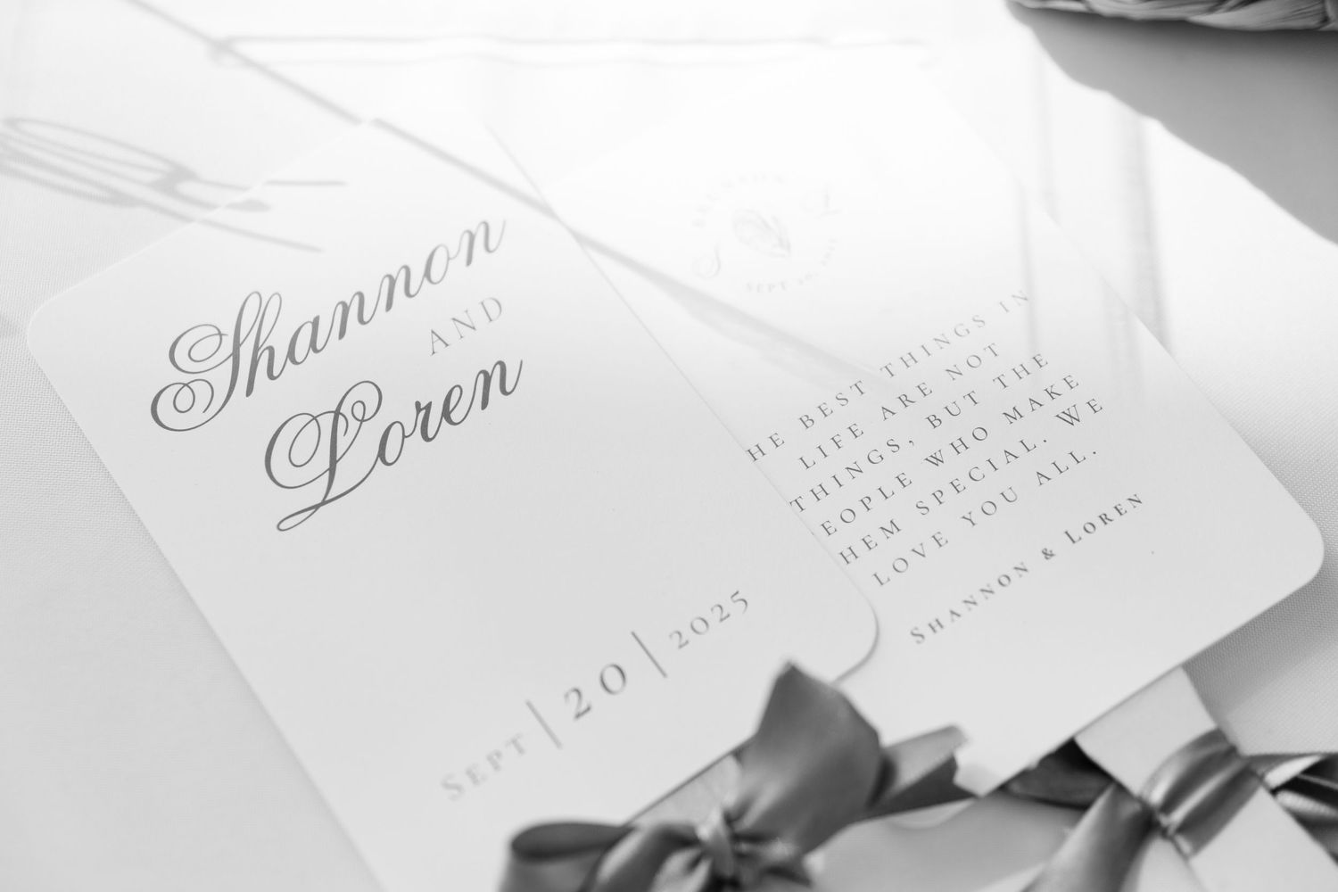 Elegant wedding invitation in classic calligraphy printed on white paper.