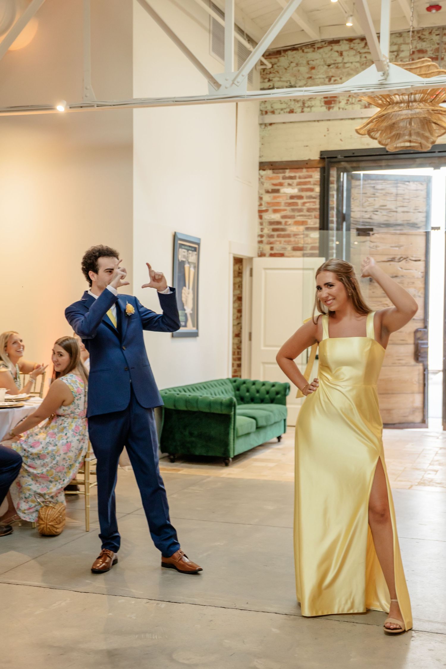 Fun photo series showing wedding party members dancing and posing playfully in a rustic brick-walled venue.