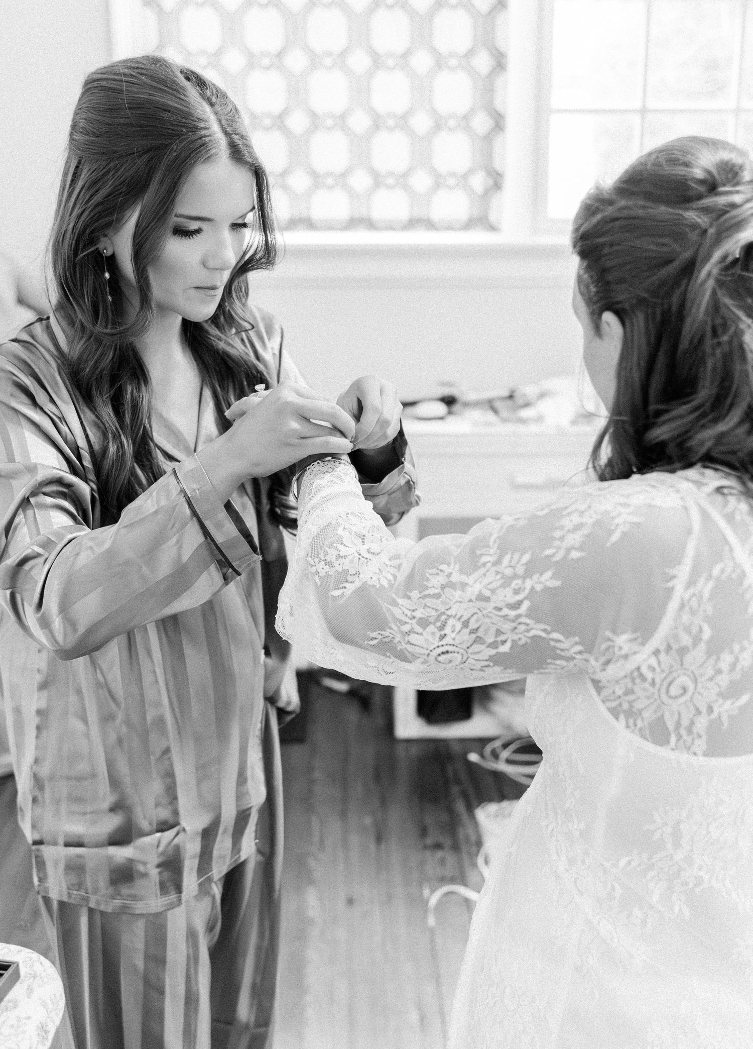 A black and white series of images showing people in denim jackets and lace robes getting ready for an event.