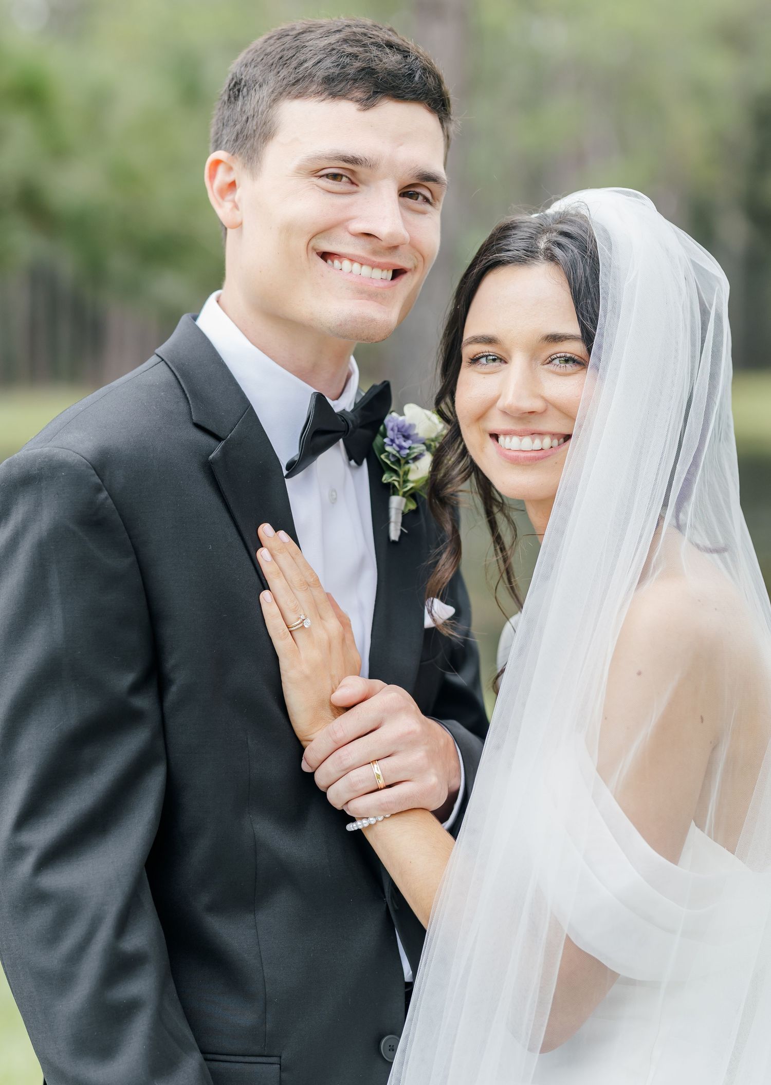 Joyful wedding portraits showing candid moments and laughter between bride and groom.