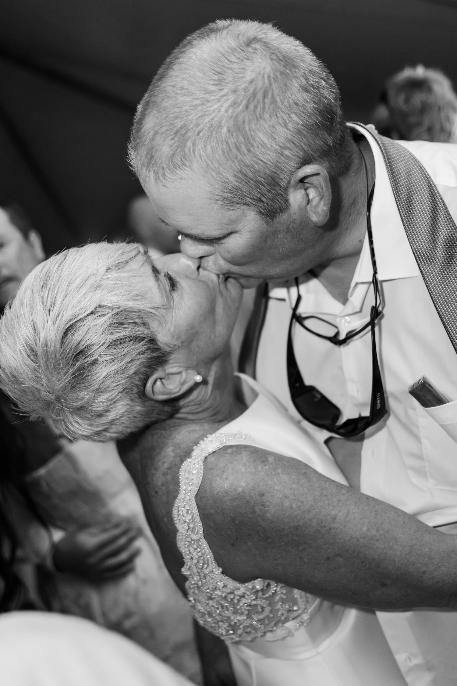 Black and white photo of an intimate moment during a wedding dance.