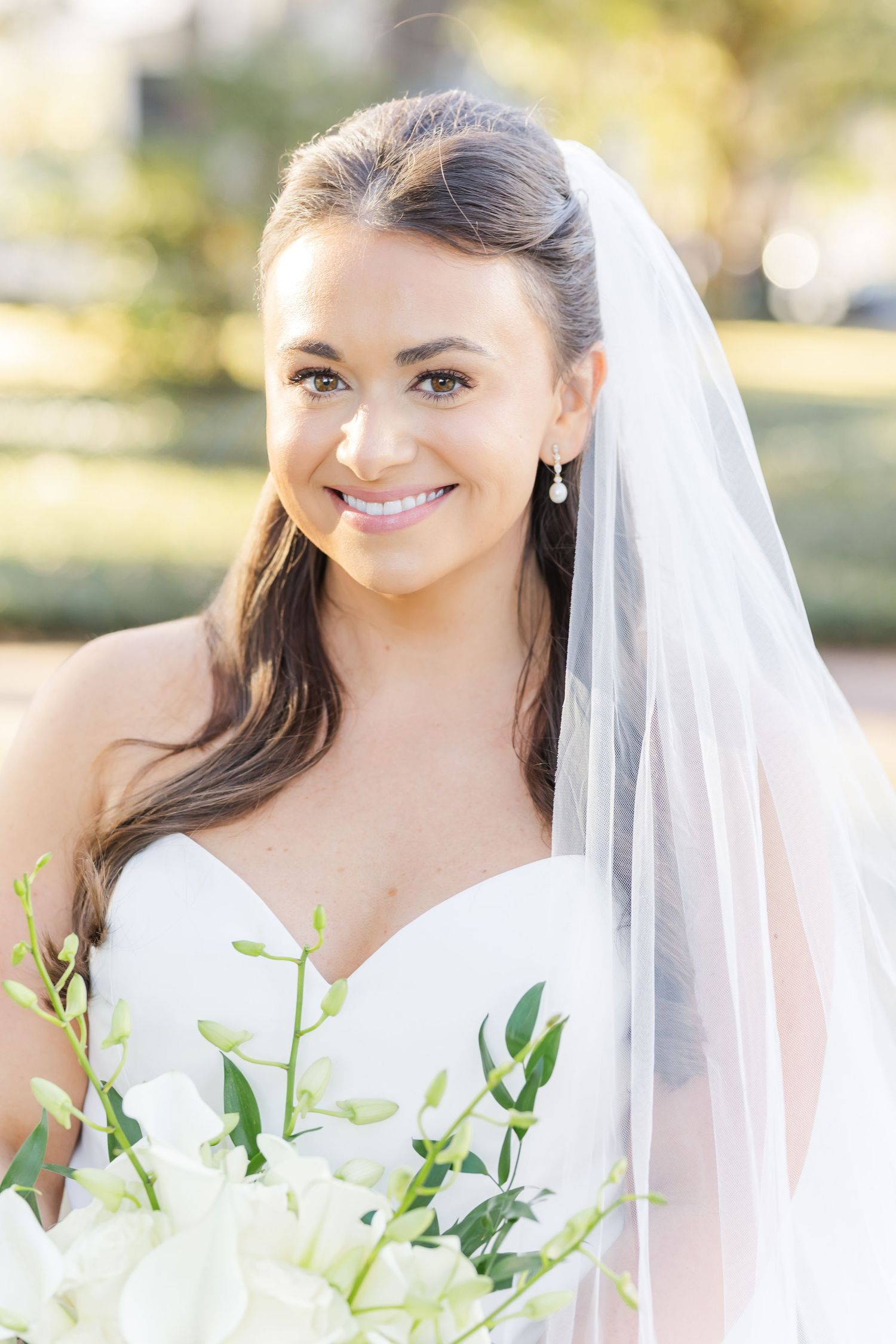 Series of romantic bridal portraits featuring a white veil and delicate greenery bouquet in soft natural light.