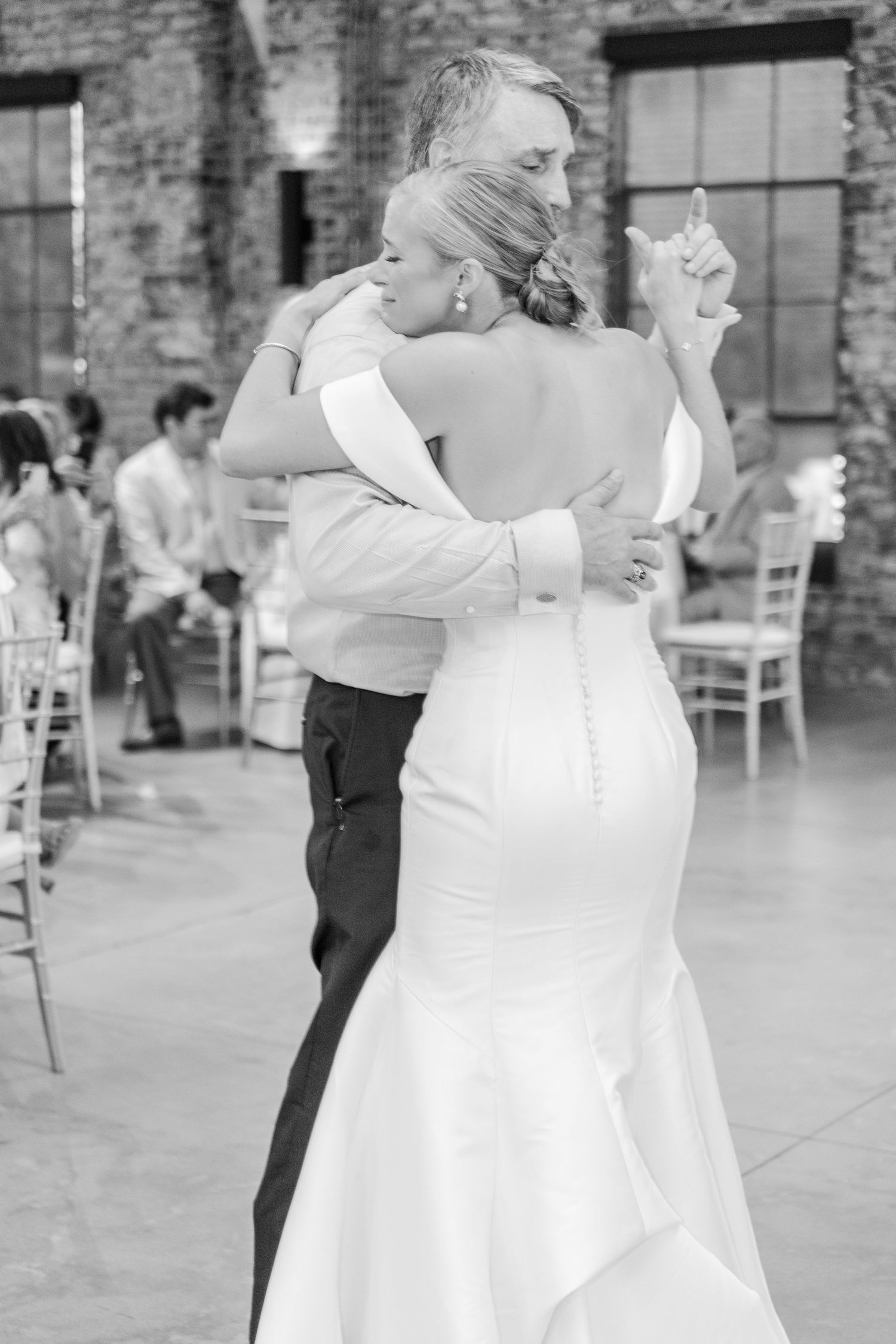 Black and white photos show couples dancing together at a formal event in a rustic venue.