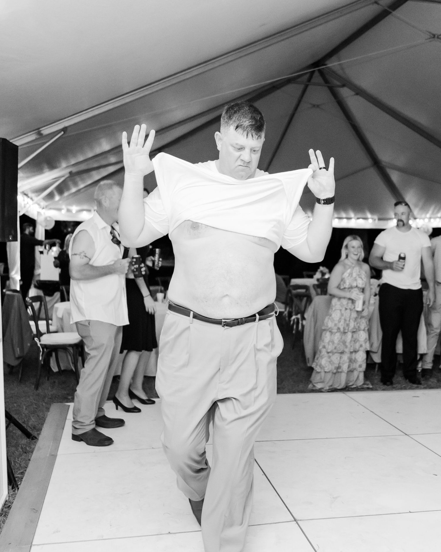 Black and white photos show wedding guests dancing together on a white dance floor at a reception celebration.