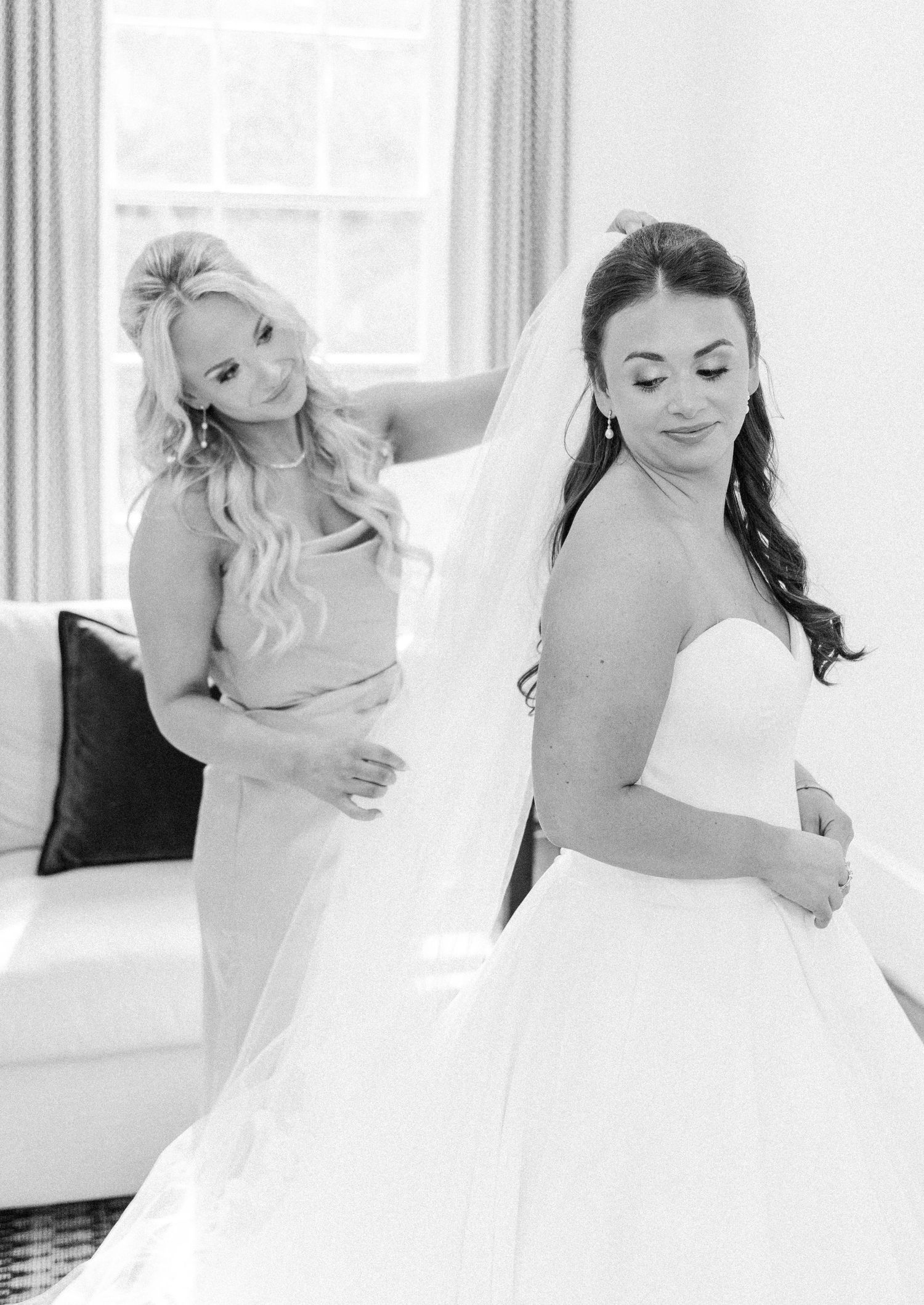 A black and white photo collage showing a bride in a white wedding dress posing gracefully in different positions.