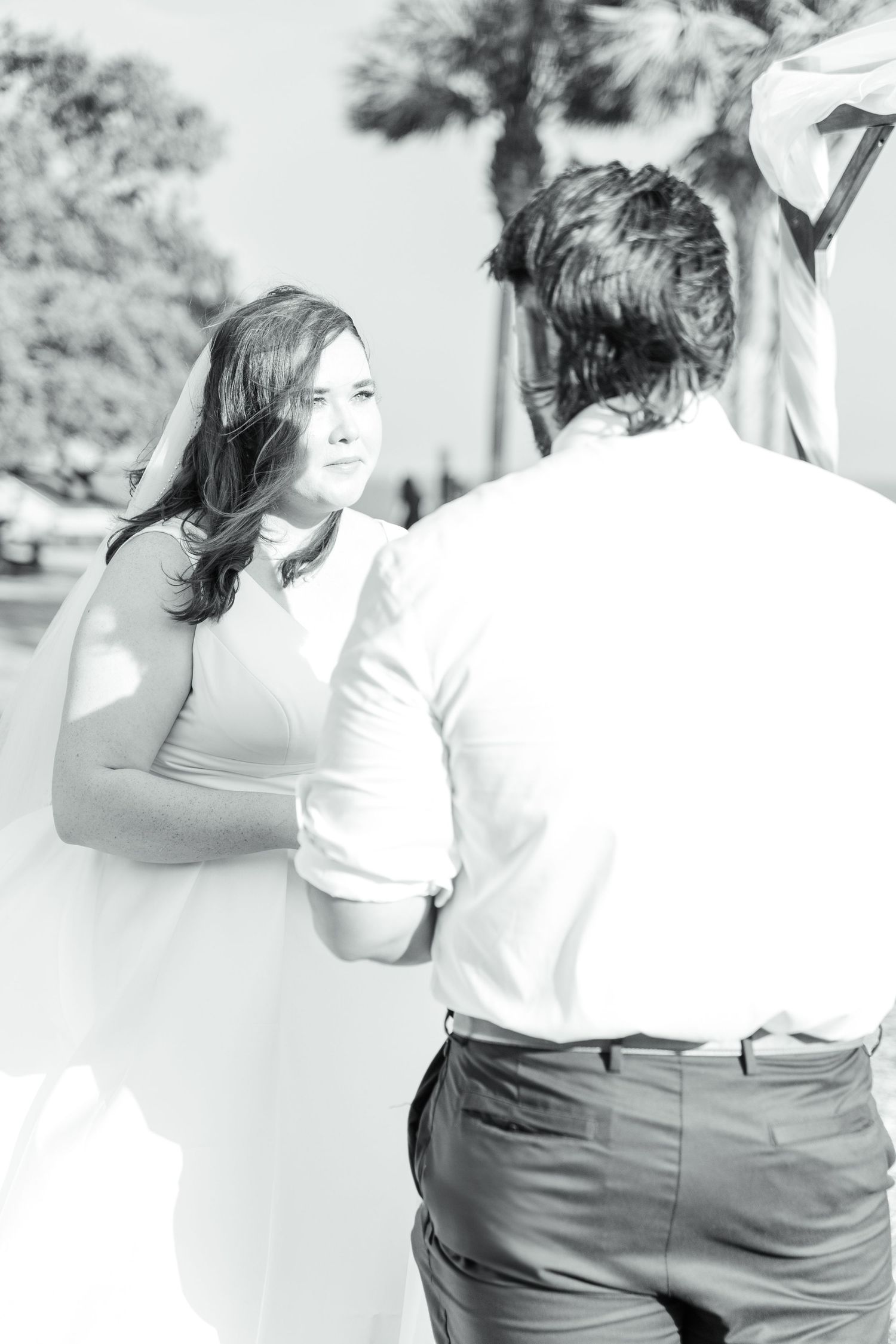 A couple dances intimately in a black and white photo sequence showing graceful movements and tender expressions.