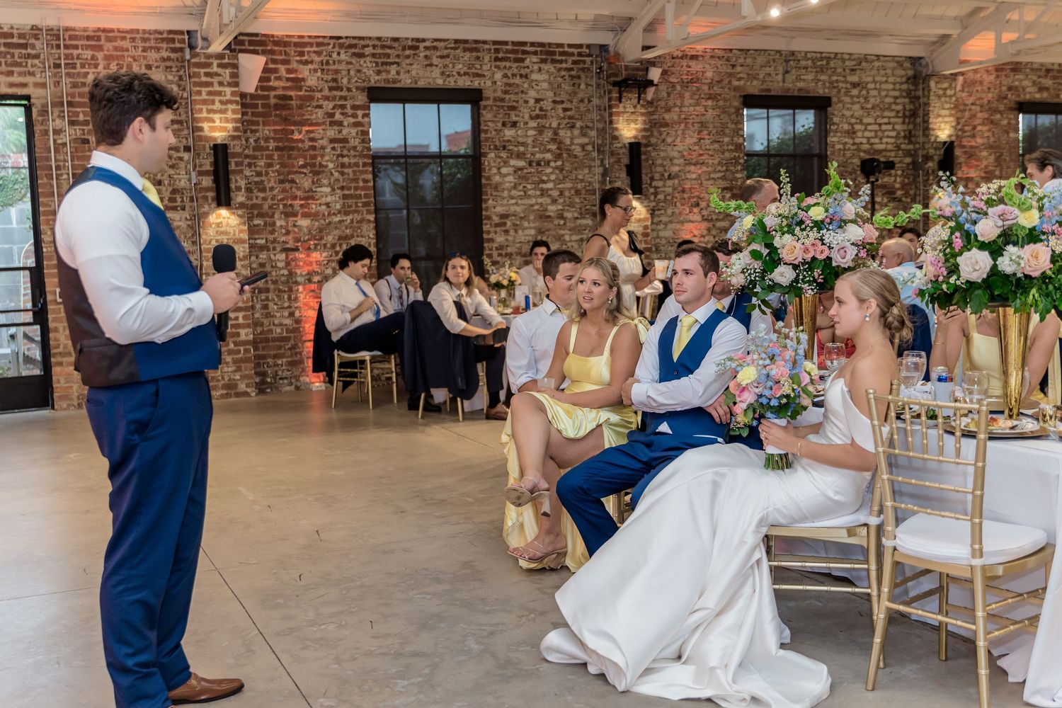 A wedding reception panorama shows guests dining in an elegant brick-walled venue with floral centerpieces and warm lighting.